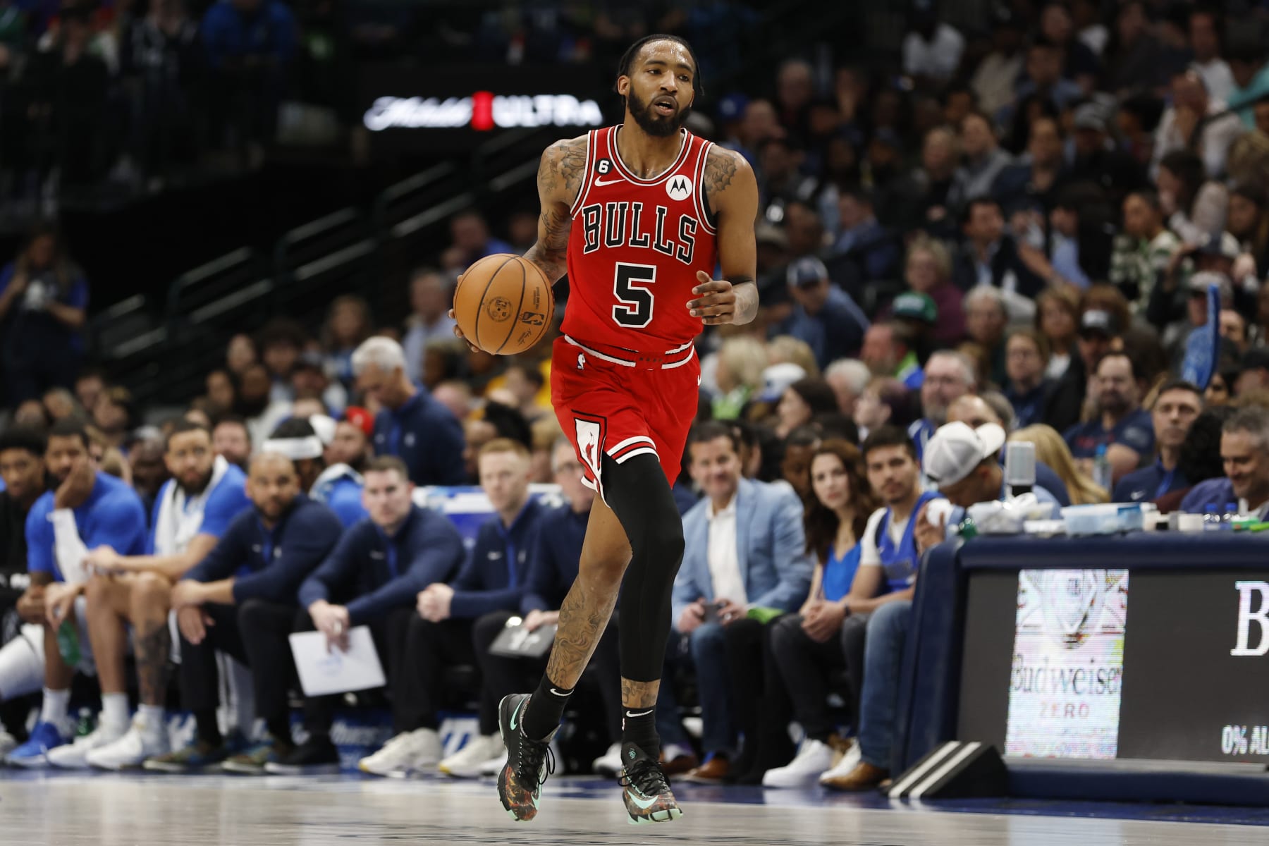 DALLAS, TEXAS - APRIL 07: Derrick Jones Jr. #5 of the Chicago Bulls dribbles the ball up court in the second half against the Dallas Mavericks at American Airlines Center on April 07, 2023 in Dallas, Texas. NOTE TO USER: User expressly acknowledges and agrees that, by downloading and or using this photograph, User is consenting to the terms and conditions of the Getty Images License Agreement. (Photo by Tim Heitman/Getty Images)