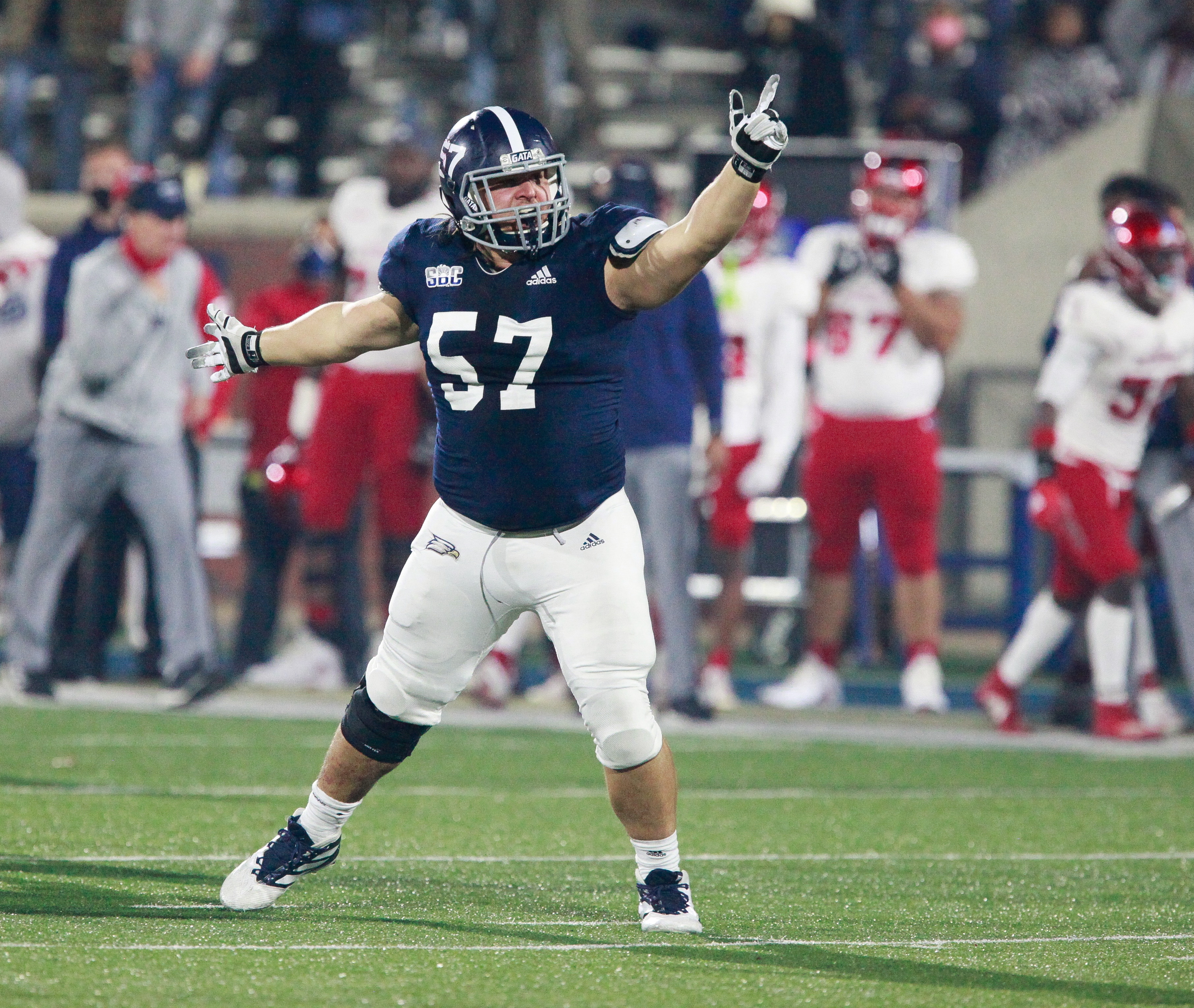 STATESBORO, GA - DECEMBER 05: Gavin Adcock #57 of the Georgia Southern Eagles celebrates a fourth down stop against the Florida Atlantic Owls during the second half at Allen E. Paulson Stadium on December 5, 2020 in Statesboro, Georgia. (Photo by Chris Thelen/Getty Images)