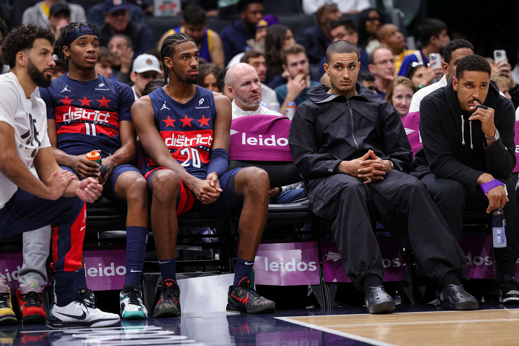 WASHINGTON, DC - NOVEMBER 04: A general view as Anthony Gill #16, Bilal Coulibaly #0, Alexandre Sarr #20, Kyle Kuzma #33, and Malcolm Brogdon #15 of the Washington Wizards loo on from the bench during the second half at Capital One Arena on November 04, 2024 in Washington, DC. NOTE TO USER: User expressly acknowledges and agrees that, by downloading and or using this photograph, User is consenting to the terms and conditions of the Getty Images License Agreement. (Photo by Scott Taetsch/Getty Images)