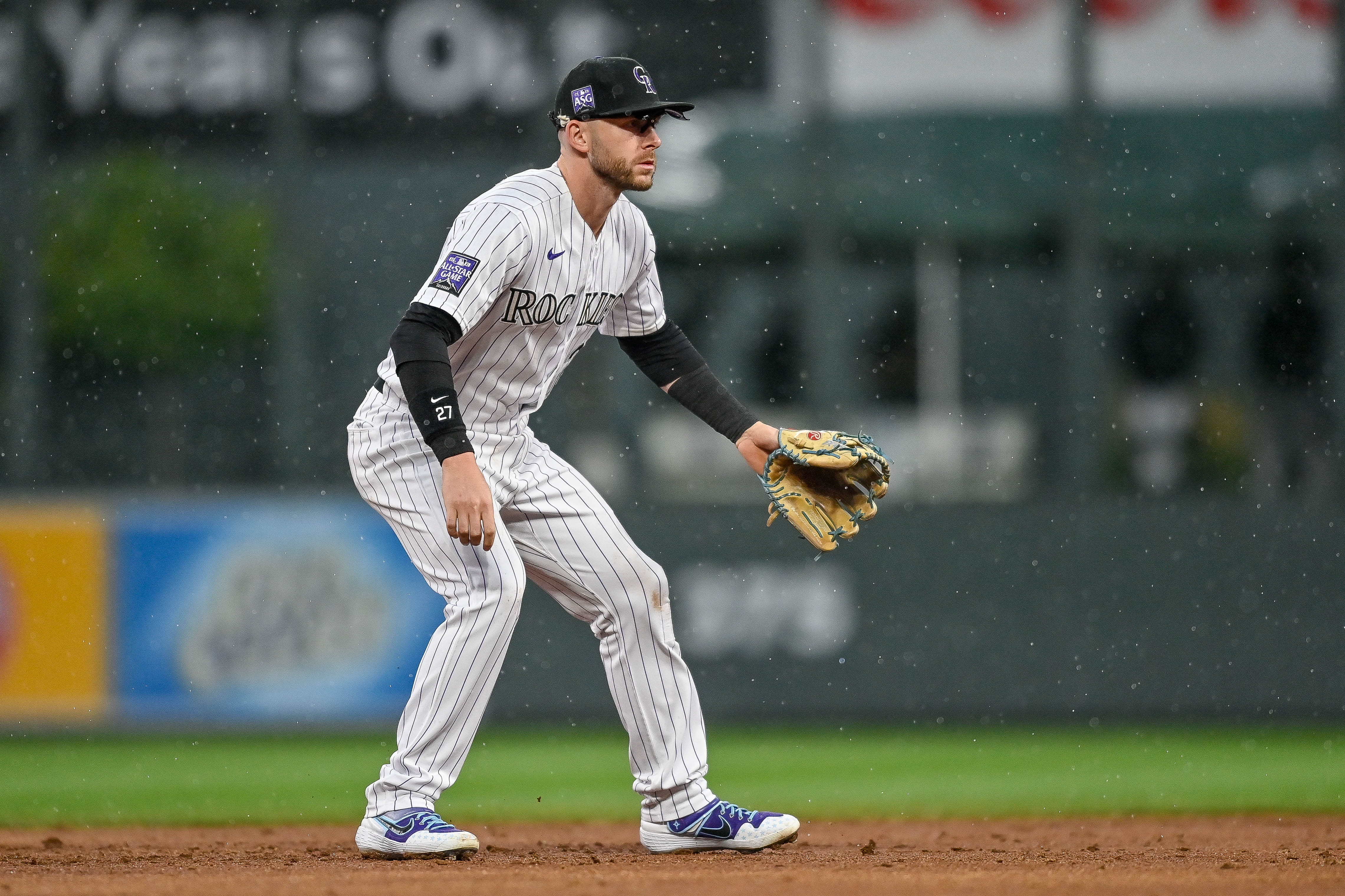 DENVER, CO - SEPTEMBER 29:  Colorado Rockies shortstop Trevor Story (27) plays defense as rain falls during a game between the Colorado Rockies and the Washington Nationals at Coors Field in Denver, Colorado on September 29, 2021. (Photo by Dustin Bradford/Icon Sportswire via Getty Images)