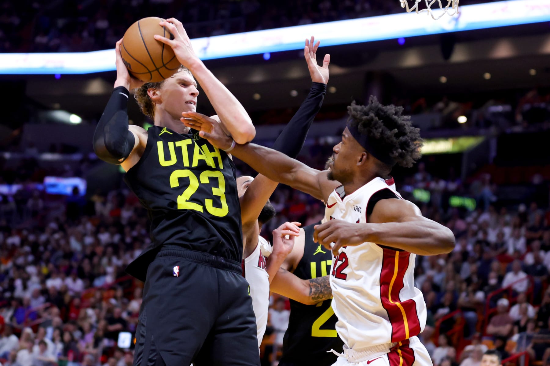 MIAMI, FLORIDA - MARCH 13: Lauri Markkanen #23 of the Utah Jazz shoots over Jimmy Butler #22 of the Miami Heat during the fourth quarter of the game at Miami-Dade Arena on March 13, 2023 in Miami, Florida. NOTE TO USER: User expressly acknowledges and agrees that, by downloading and or using this photograph, User is consenting to the terms and conditions of the Getty Images License Agreement. (Photo by Megan Briggs/Getty Images)