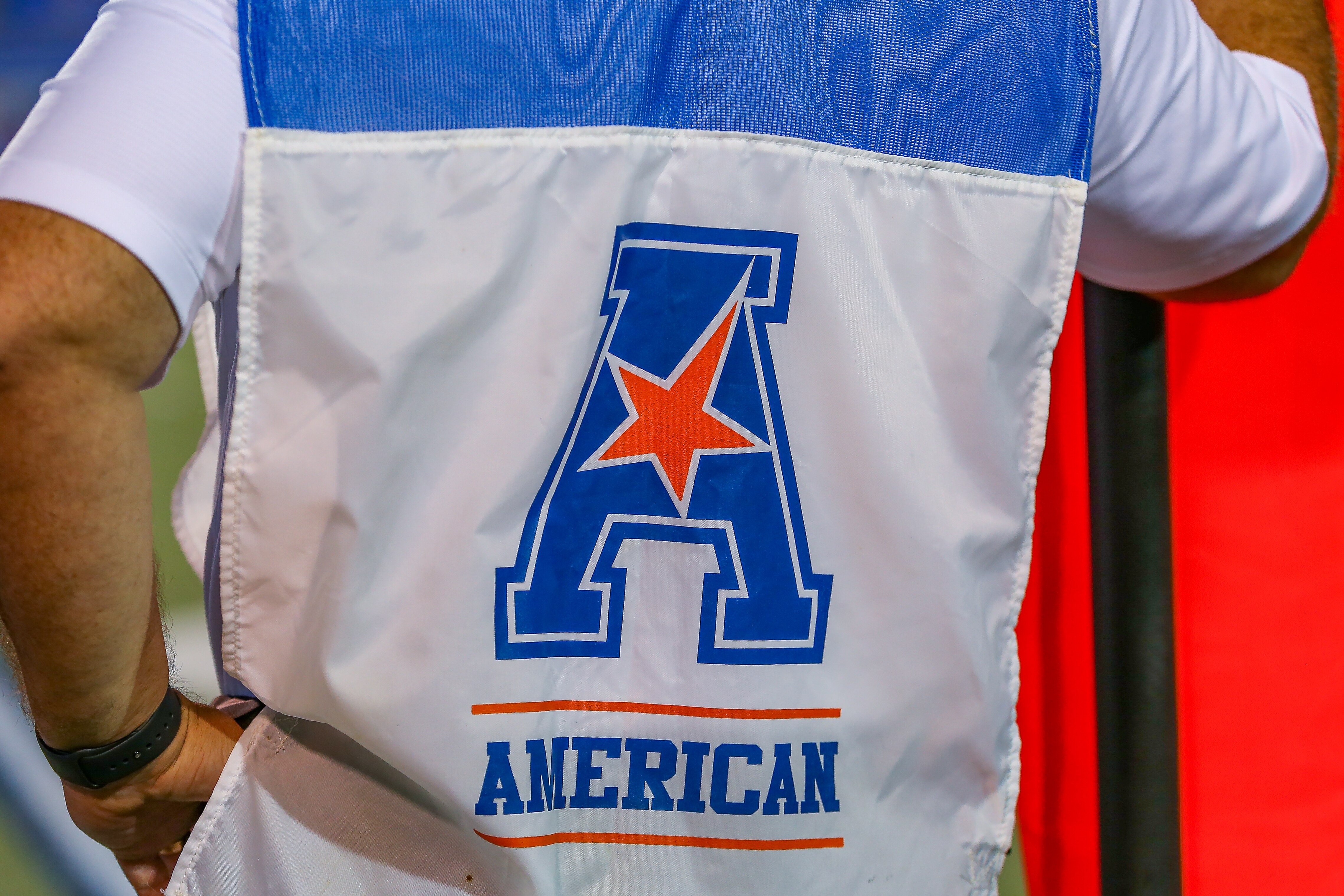 MEMPHIS, TN - OCTOBER 14: The American Athletic Conference logo on the vest of a chain gang member during the game between the Memphis Tigers and the Navy Midshipmen on October 14, 2021, at Liberty Bowl Memorial Stadium. (Photo by Chris McDill/Icon Sportswire via Getty Images)