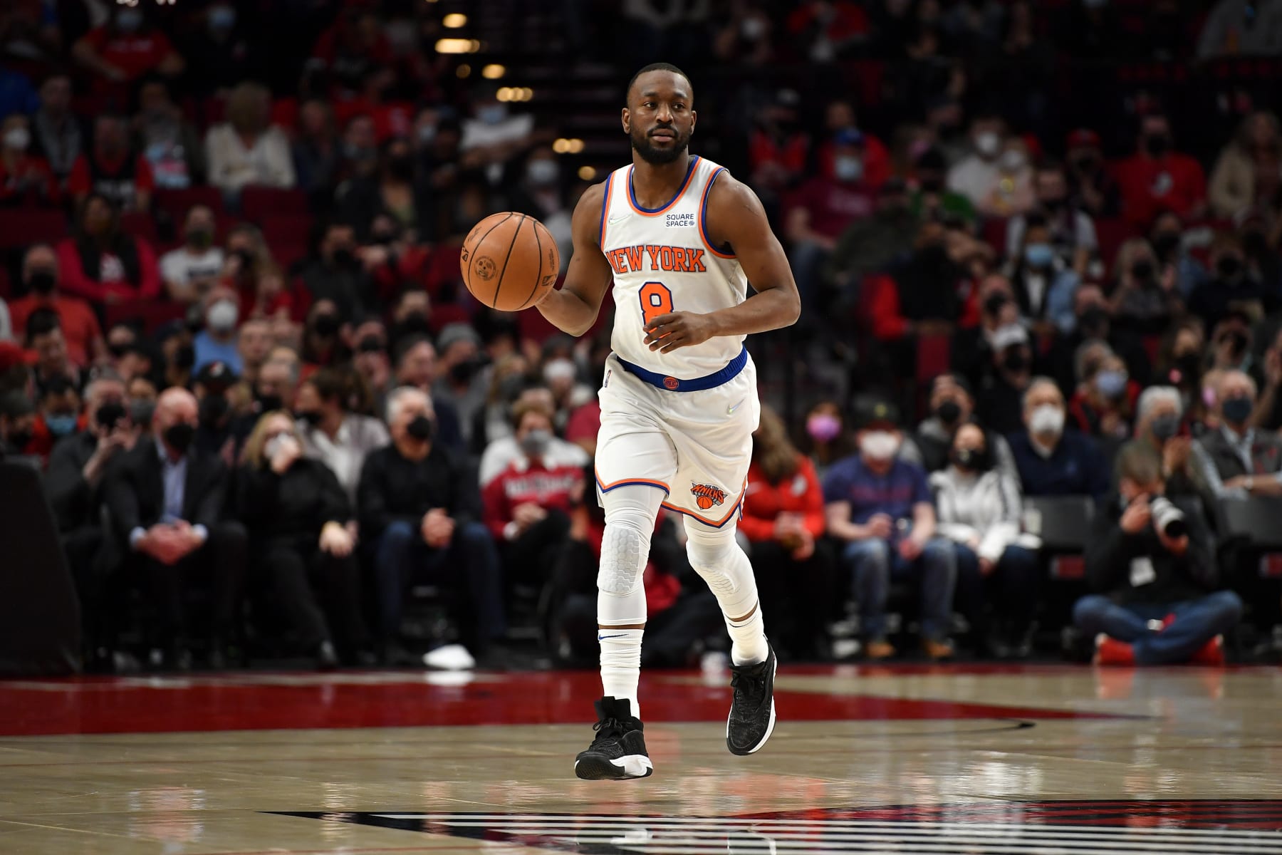 PORTLAND, OREGON - FEBRUARY 12: Kemba Walker #8 of the New York Knicks brings the ball up court during the first quarter against the Portland Trail Blazers at the Moda Center on February 12, 2022 in Portland, Oregon. NOTE TO USER: User expressly acknowledges and agrees that, by downloading and or using this photograph, User is consenting to the terms and conditions of the Getty Images License Agreement. (Photo by Alika Jenner/Getty Images)