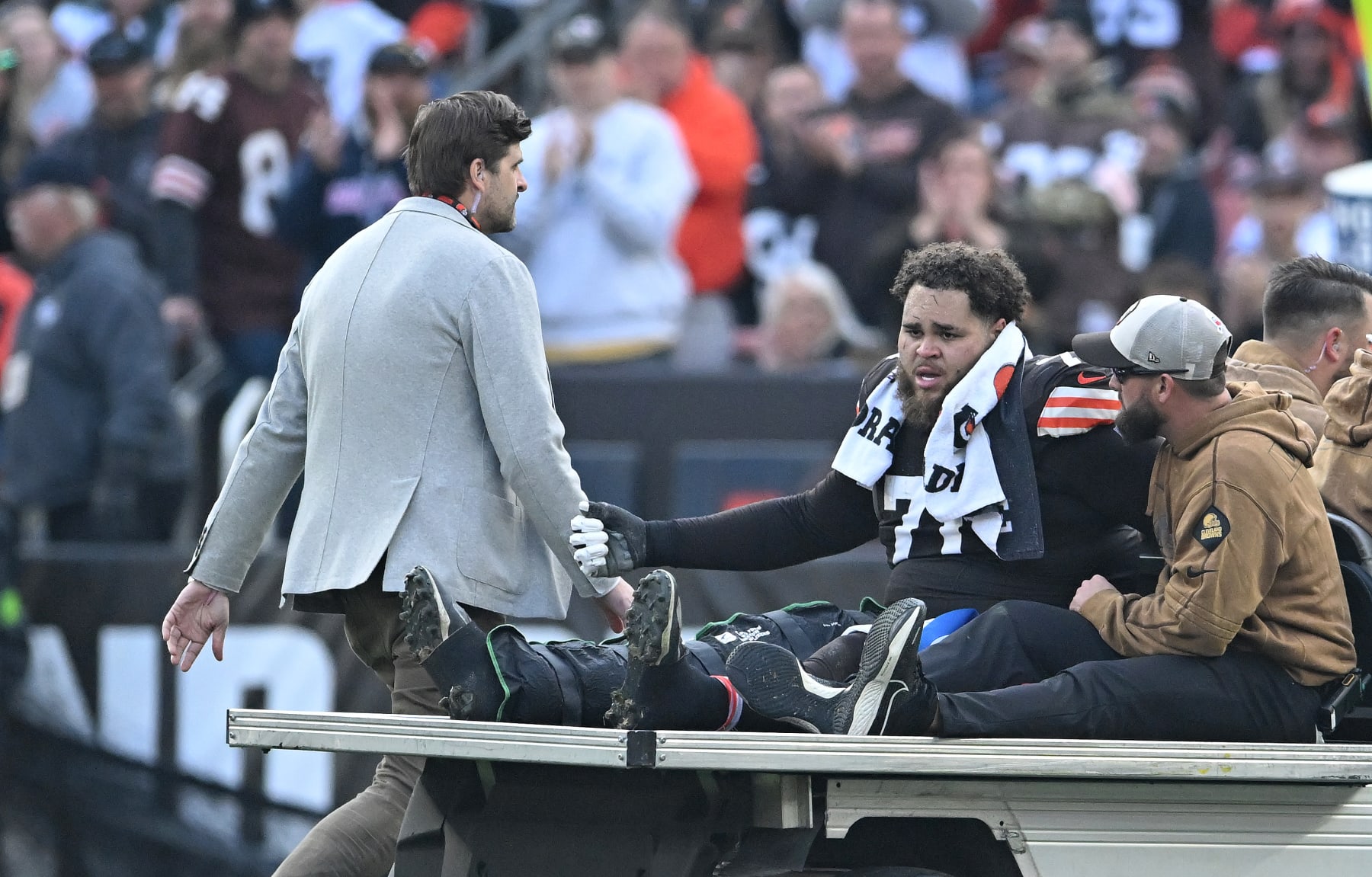 CLEVELAND, OHIO - NOVEMBER 05: Jedrick Wills Jr. #71 of the Cleveland Browns is carted off the field after suffering an injury during the third quarter of the game against the Arizona Cardinals at Cleveland Browns Stadium on November 05, 2023 in Cleveland, Ohio. (Photo by Nick Cammett/Getty Images)