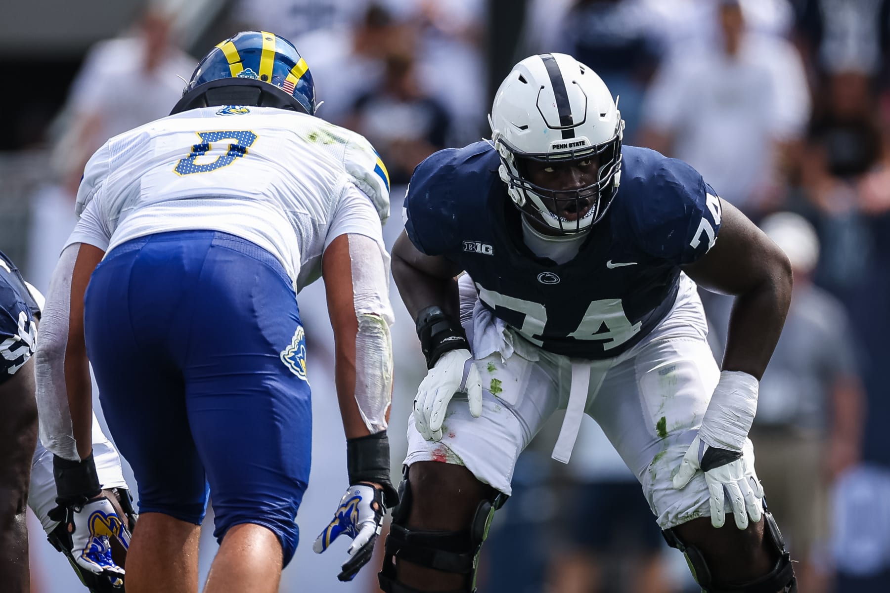 STATE COLLEGE, PA - SEPTEMBER 09: Olumuyiwa Fashanu #74 of the Penn State Nittany Lions lines up against Jackson Taylor #0 of the Delaware Fightin Blue Hens during the first half at Beaver Stadium on September 9, 2023 in State College, Pennsylvania. (Photo by Scott Taetsch/Getty Images)