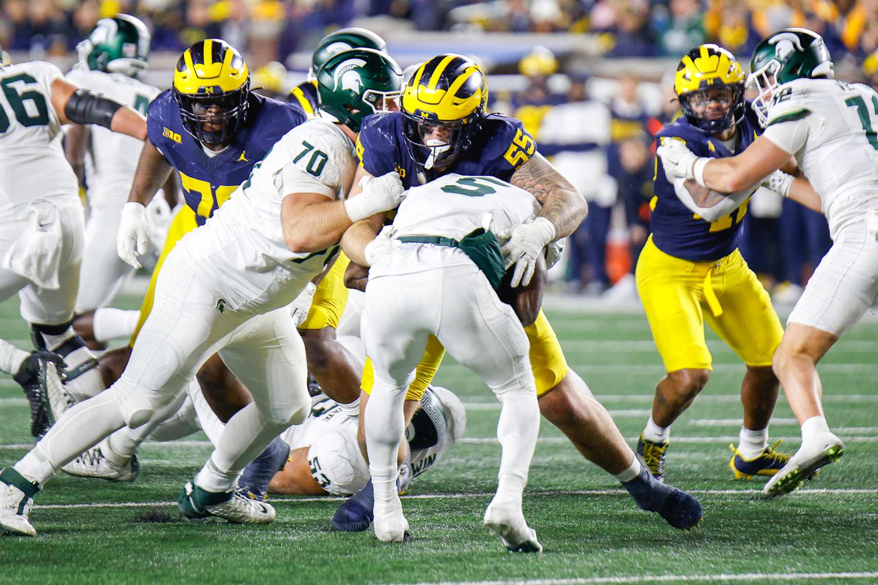 ANN ARBOR, MI - OCTOBER 26: Mason Graham #55 of Michigan makes a tackle for loss on Nathan Carter #5 of Michigan State during a game between Michigan State University and University of Michigan at Michigan Stadium on October 26, 2024 in Ann Arbor, Michigan. (Photo by Michael Miller/ISI Photos/Getty Images)