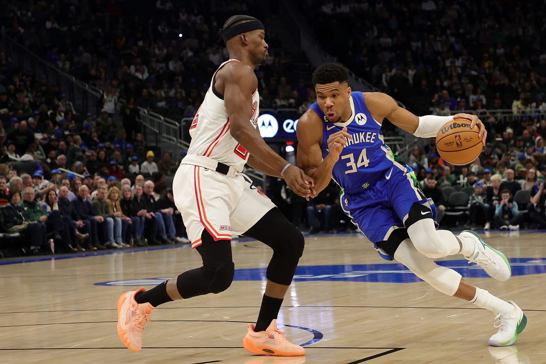MILWAUKEE, WISCONSIN - FEBRUARY 04: Giannis Antetokounmpo #34 of the Milwaukee Bucks is defended by Jimmy Butler #22 of the Miami Heat during a game at Fiserv Forum on February 04, 2023 in Milwaukee, Wisconsin. NOTE TO USER: User expressly acknowledges and agrees that, by downloading and or using this photograph, User is consenting to the terms and conditions of the Getty Images License Agreement. (Photo by Stacy Revere/Getty Images)