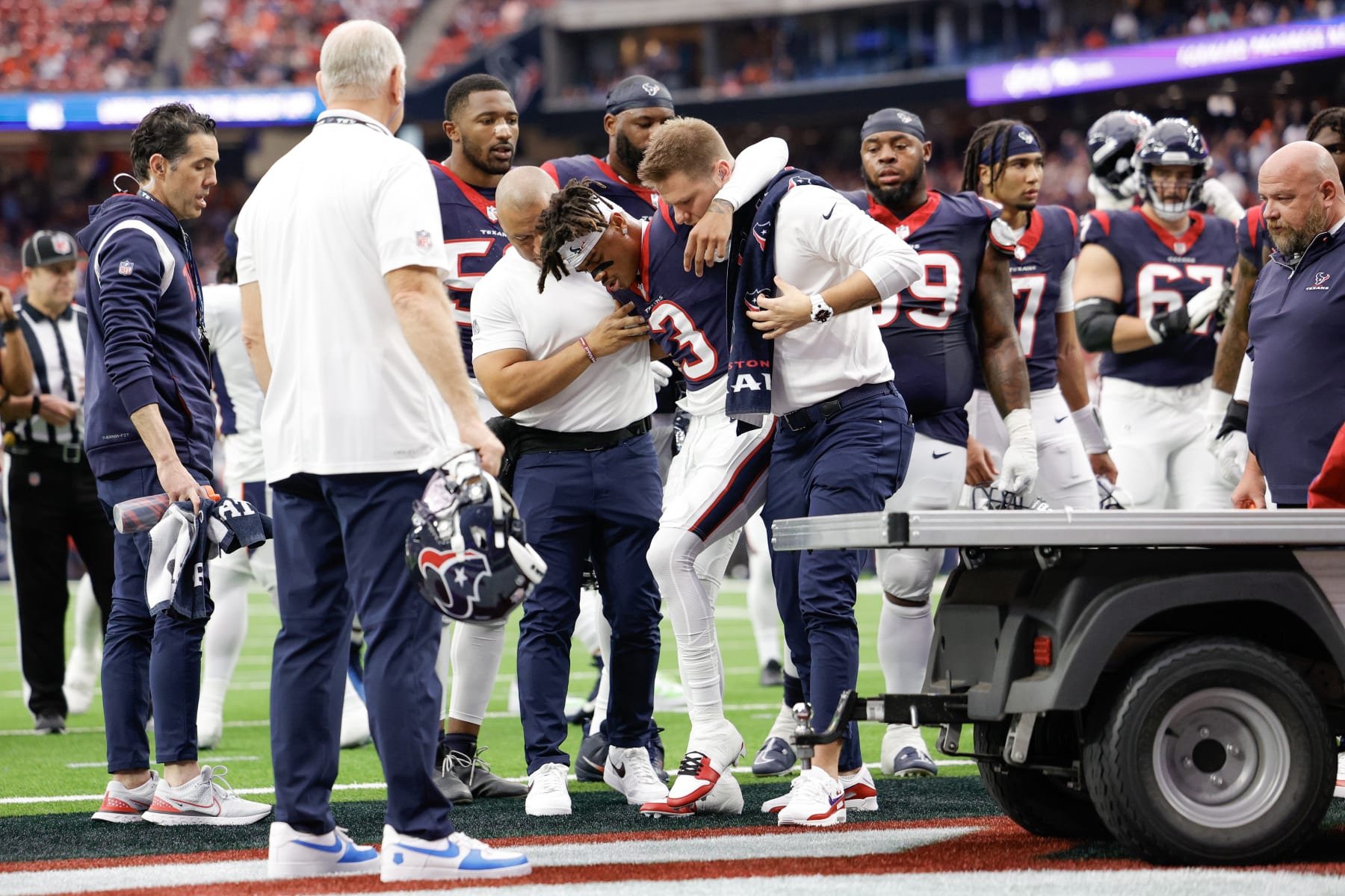 HOUSTON, TEXAS - DECEMBER 03: Tank Dell #3 of the Houston Texans is carted off the field after being injured in the first quarter against the Denver Broncos at NRG Stadium on December 03, 2023 in Houston, Texas. (Photo by Carmen Mandato/Getty Images)