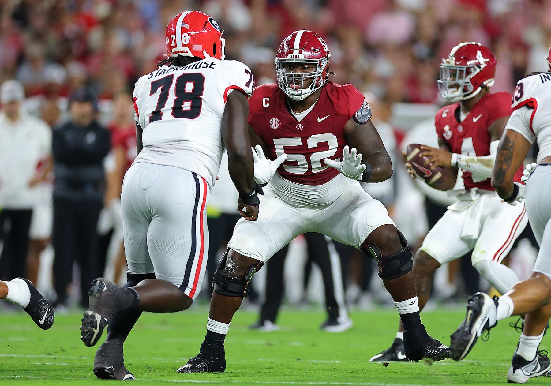 TUSCALOOSA, ALABAMA - SEPTEMBER 28:  Tyler Booker #52 of the Alabama Crimson Tide lines up to block against Nazir Stackhouse #78 of the Georgia Bulldogs during the first quarter at Bryant-Denny Stadium on September 28, 2024 in Tuscaloosa, Alabama. (Photo by Kevin C. Cox/Getty Images)