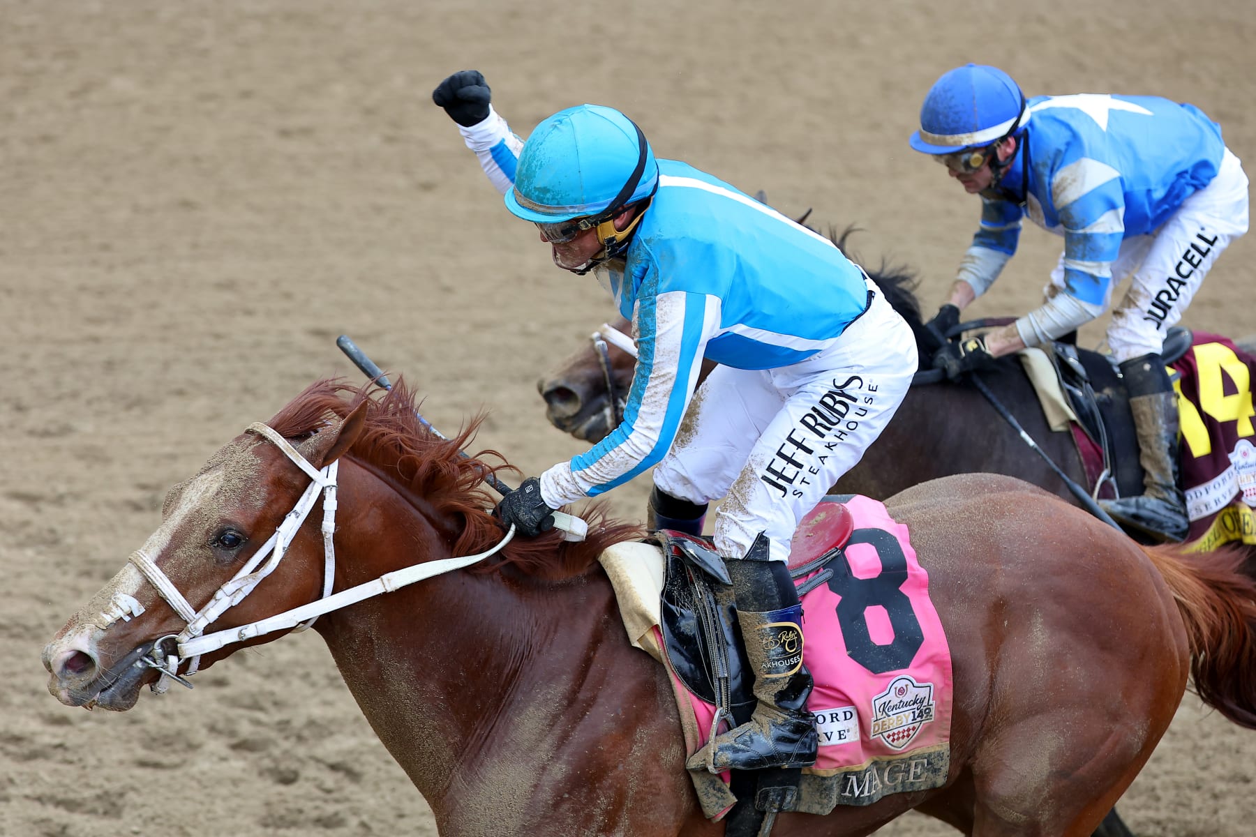 LOUISVILLE, KENTUCKY - MAY 06: Jockey Javier Castellano celebrates atop of Mage #8 after winning the 149th running of the Kentucky Derby at Churchill Downs on May 06, 2023 in Louisville, Kentucky. (Photo by Michael Reaves/Getty Images)