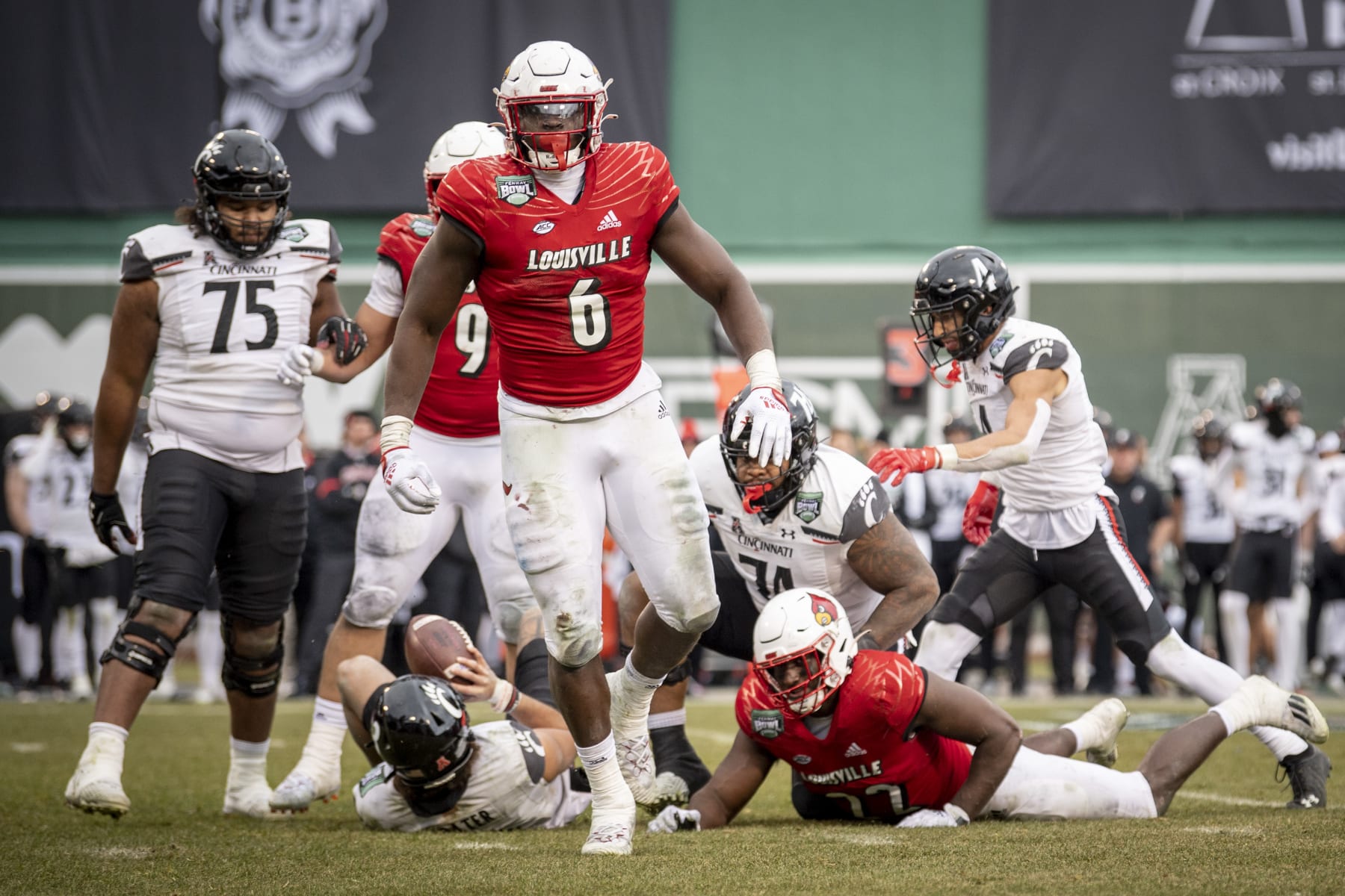 BOSTON, MA - DECEMBER 17: YaYa Diaby #6 of the Louisville Cardinals reacts after making a sack during the 2022 Wasabi Fenway Bowl against the Cincinnati Bearcats on December 17, 2022 at Fenway Park in Boston, Massachusetts. (Photo by Maddie Malhotra/Boston Red Sox/Getty Images)