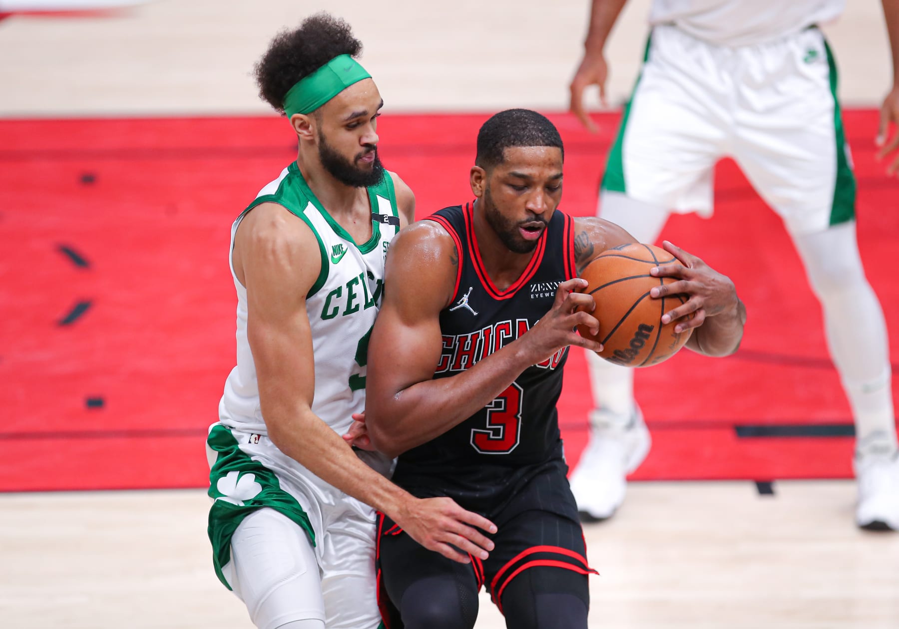 CHICAGO, IL - APRIL 06: Boston Celtics guard Derrick White (9) posts up against Chicago Bulls center Tristan Thompson (3) during a NBA game between the Boston Celtics and the Chicago Bulls on April 6, 2022 at the United Center in Chicago, IL. (Photo by Melissa Tamez/Icon Sportswire via Getty Images)