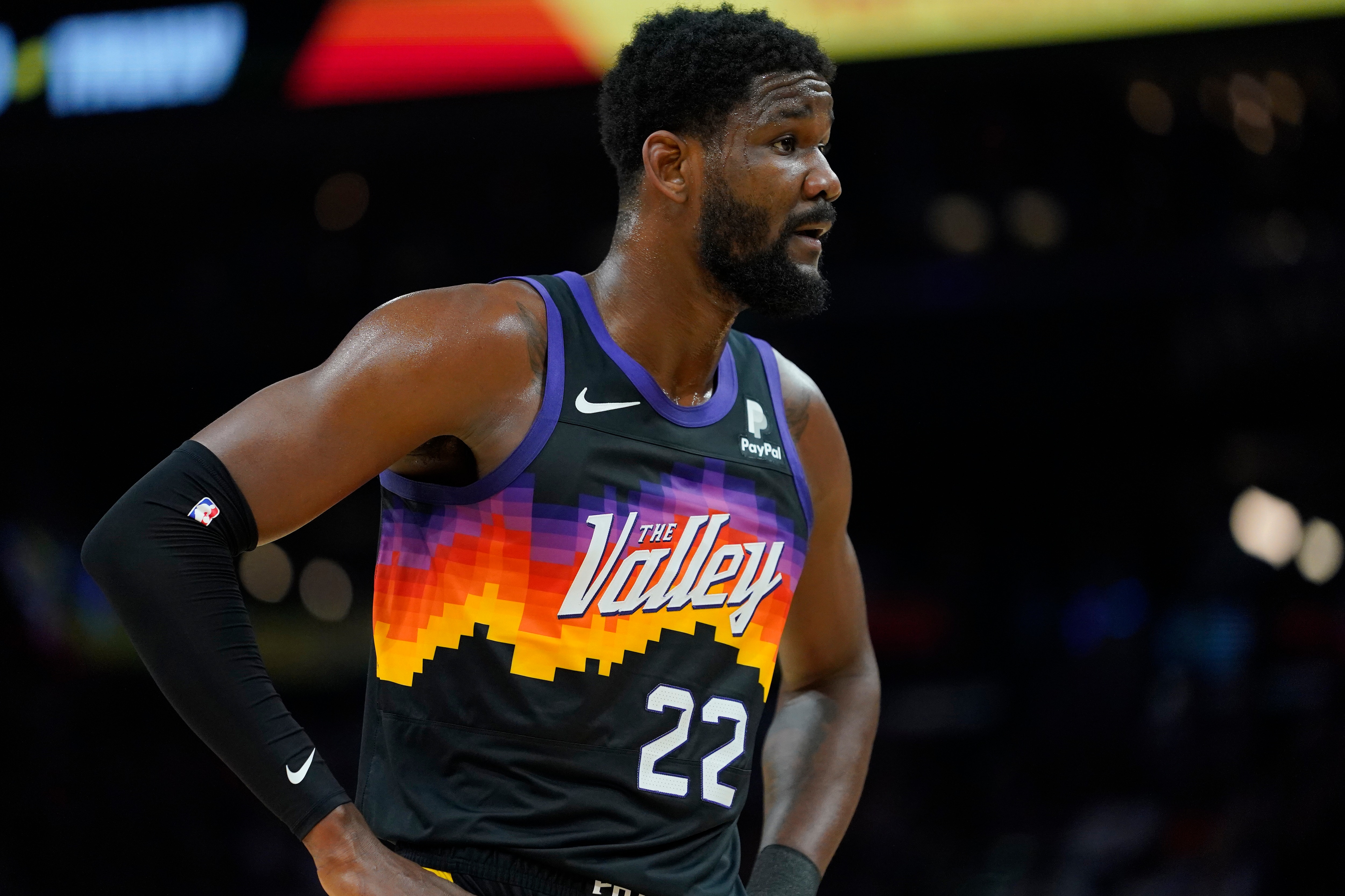 Phoenix Suns center Deandre Ayton (22) looks away after being fouled during the first half of Game 7 of an NBA basketball Western Conference playoff semifinal against theDallas Mavericks, Sunday, May 15, 2022, in Phoenix. (AP Photo/Matt York)