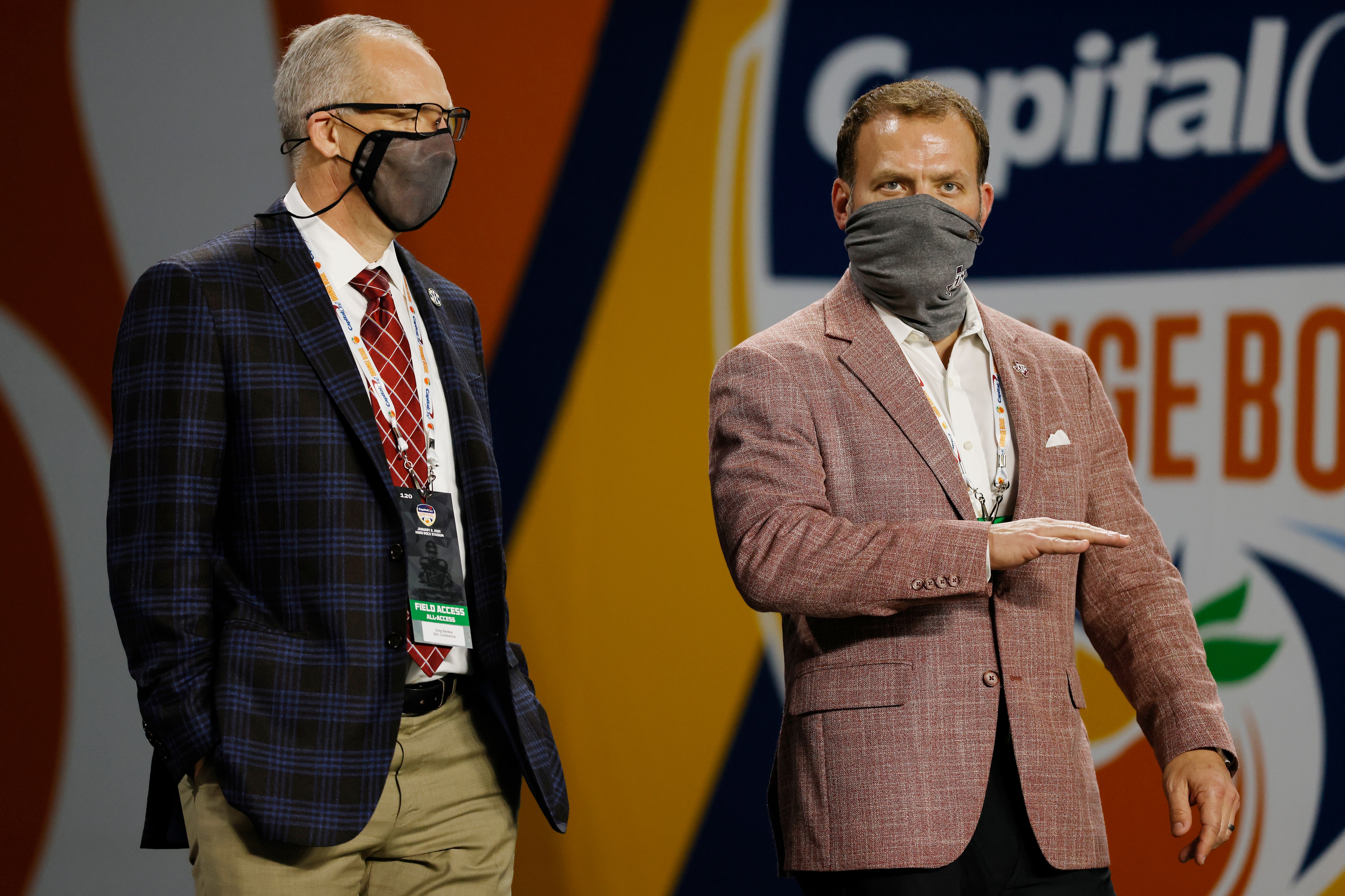 MIAMI GARDENS, FLORIDA - JANUARY 02: Southeastern Conference commissioner Greg Sankey (L) talks with athletic director Ross Bjork of the Texas A&M Aggies prior to the Capital One Orange Bowl against the North Carolina Tar Heels at Hard Rock Stadium on January 02, 2021 in Miami Gardens, Florida. (Photo by Michael Reaves/Getty Images)