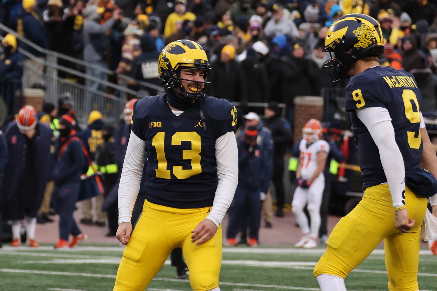 ANN ARBOR, MICHIGAN - NOVEMBER 19: Jake Moody #13 of the Michigan Wolverines celebrates his game winning field goal with J.J. McCarthy #9 to beat the Illinois Fighting Illini 19-17 at Michigan Stadium on November 19, 2022 in Ann Arbor, Michigan. (Photo by Gregory Shamus/Getty Images)