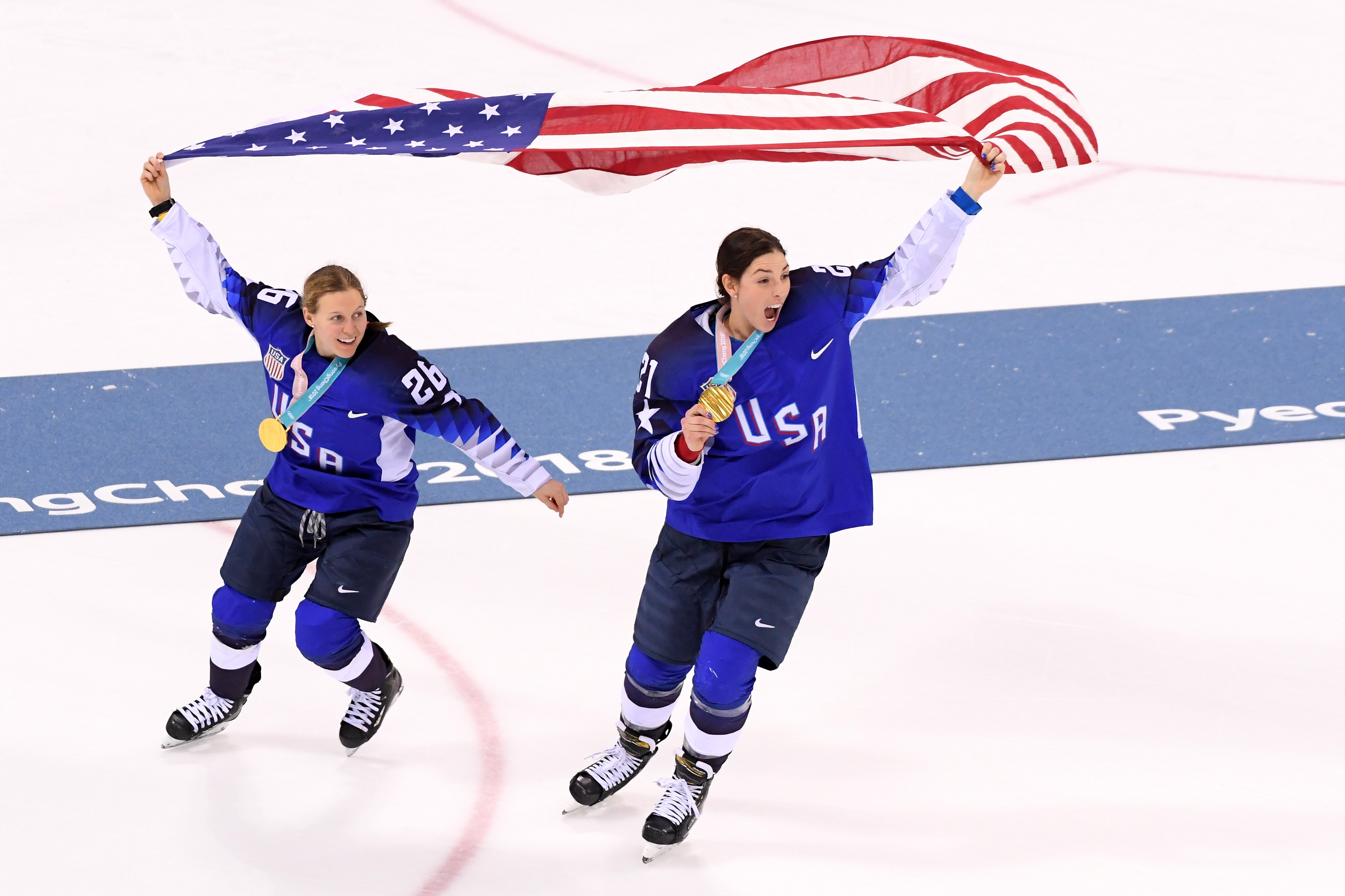 GANGNEUNG, SOUTH KOREA - FEBRUARY 22:  Gold medal winners Kendall Coyne #26 and Hilary Knight #21 of the United States celebrate after defeating Canada in a shootout in the Women's Gold Medal Game on day thirteen of the PyeongChang 2018 Winter Olympic Games at Gangneung Hockey Centre on February 22, 2018 in Gangneung, South Korea.  (Photo by Harry How/Getty Images)