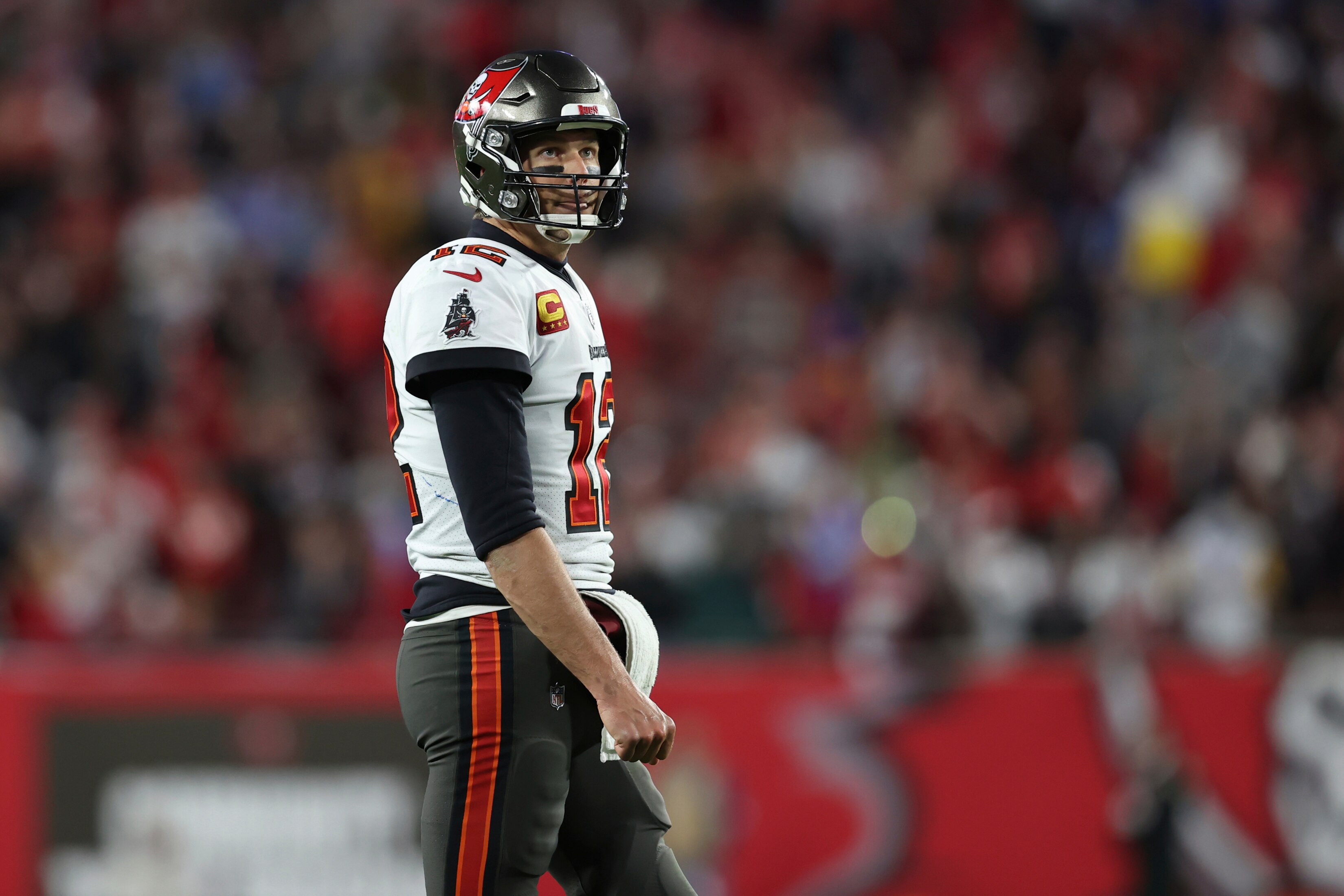 Tampa Bay Buccaneers quarterback Tom Brady (12) against the Los Angeles Rams during the second half of an NFL divisional round playoff football game Sunday, Jan. 23, 2022, in Tampa, Fla. (AP Photo/Mark LoMoglio)