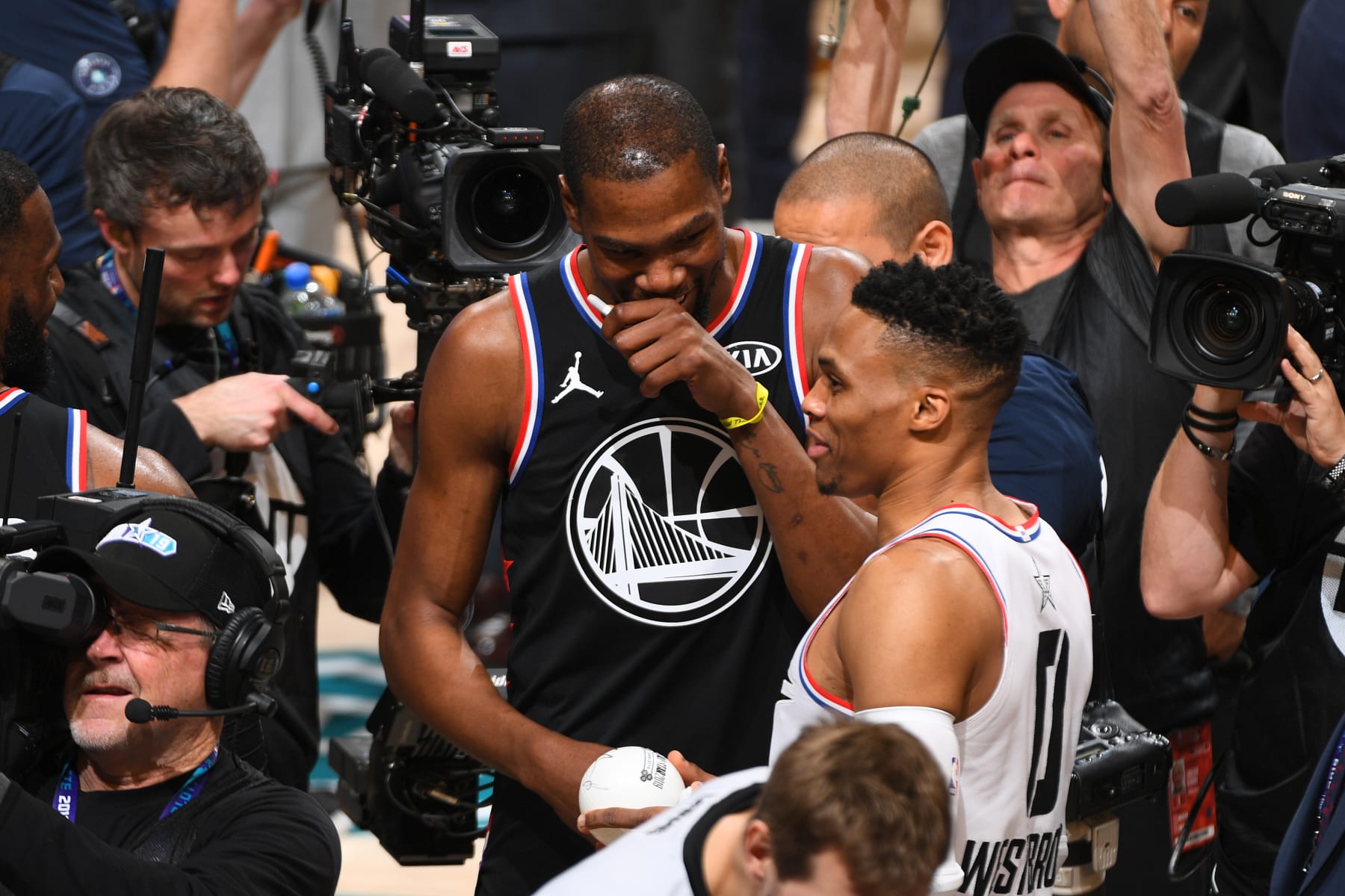 CHARLOTTE, NC - FEBRUARY 17: Kevin Durant #35 of Team LeBron and Russell Westbrook #0 of Team Giannis speak after the 2019 NBA All-Star Game on February 17, 2019 at the Spectrum Center in Charlotte, North Carolina. NOTE TO USER: User expressly acknowledges and agrees that, by downloading and/or using this photograph, user is consenting to the terms and conditions of the Getty Images License Agreement. Mandatory Copyright Notice: Copyright 2019 NBAE (Photo by Garrett Ellwood/NBAE via Getty Images)