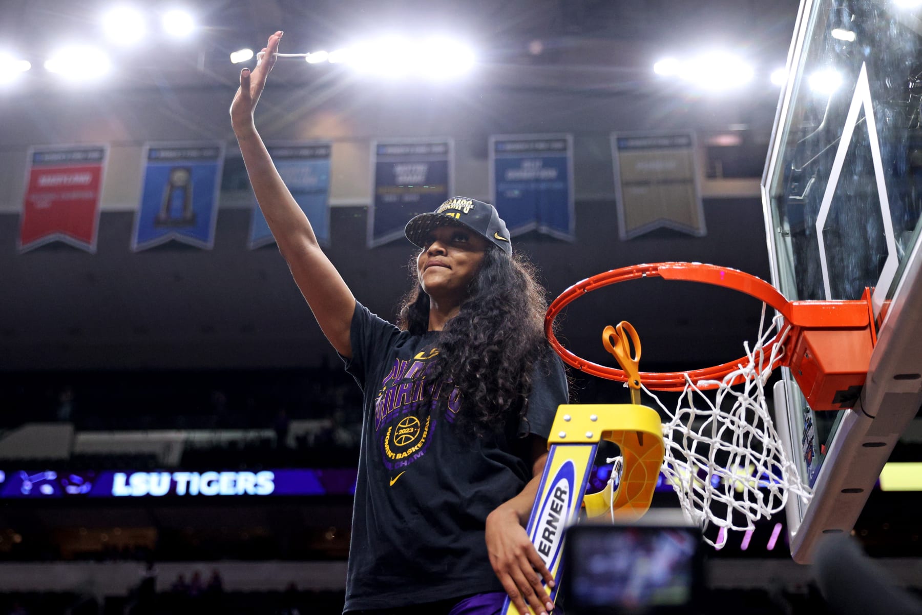 DALLAS, TEXAS - APRIL 02: Angel Reese #10 of the LSU Lady Tigers cuts down a piece of the net after defeating the Iowa Hawkeyes 102-85 during the 2023 NCAA Women's Basketball Tournament championship game at American Airlines Center on April 02, 2023 in Dallas, Texas. (Photo by Maddie Meyer/Getty Images)
