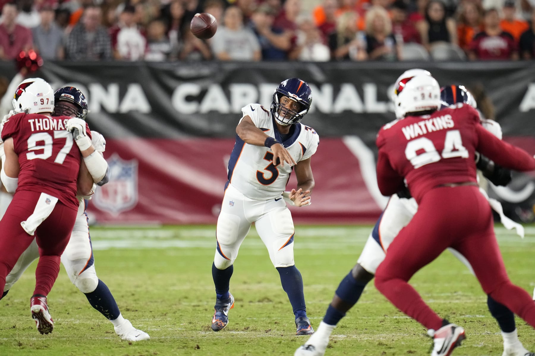 Denver Broncos quarterback Russell Wilson (3) passes against the Arizona Cardinals during the first half of an NFL preseason football game in Glendale, Ariz., Friday, Aug. 11, 2023. (AP Photo/Ross D. Franklin)