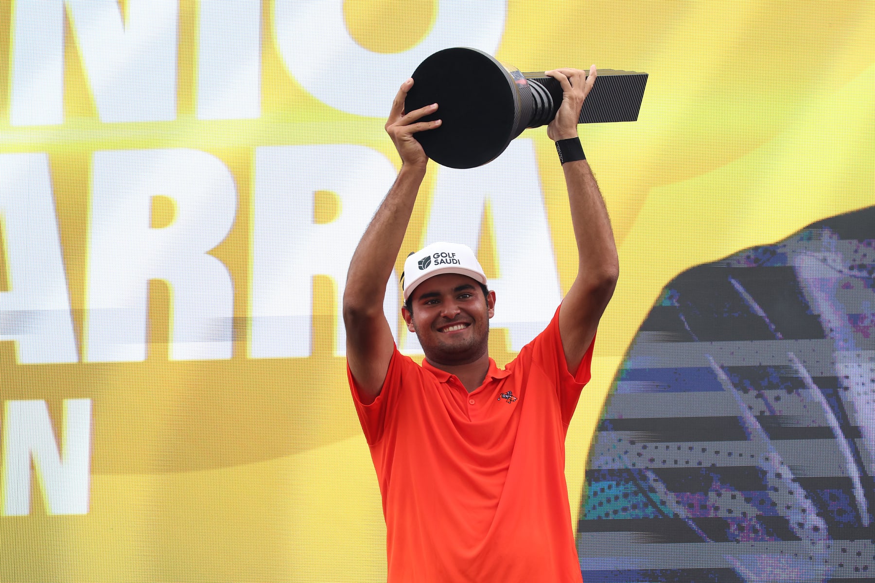 PATHUM THANI, THAILAND - OCTOBER 09: Eugenio Lopez-Chacarra of Fireballs GC celebrates with the trophy on stage after winning the individual award during Day Three of the LIV Golf Invitational - Bangkok at Stonehill Golf Course on October 09, 2022 in Pathum Thani, Thailand. (Photo by Chris Trotman/LIV Golf via Getty Images)