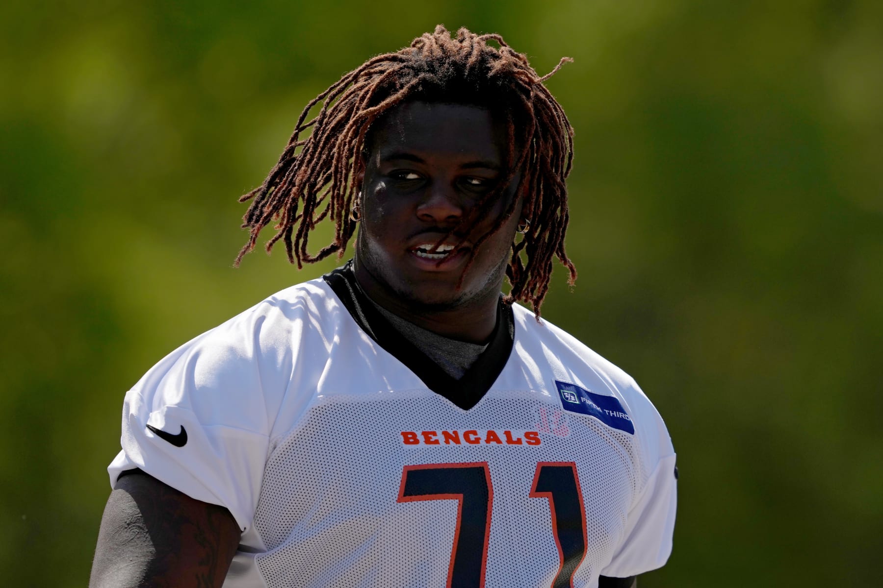 CINCINNATI, OHIO - JUNE 04: Amarius Mims #71 of the Cincinnati Bengals walks to the fields during an OTA offseason workout at the Kettering Health Bengals Practice Fields on June 04, 2024 in Cincinnati, Ohio. (Photo by Dylan Buell/Getty Images)