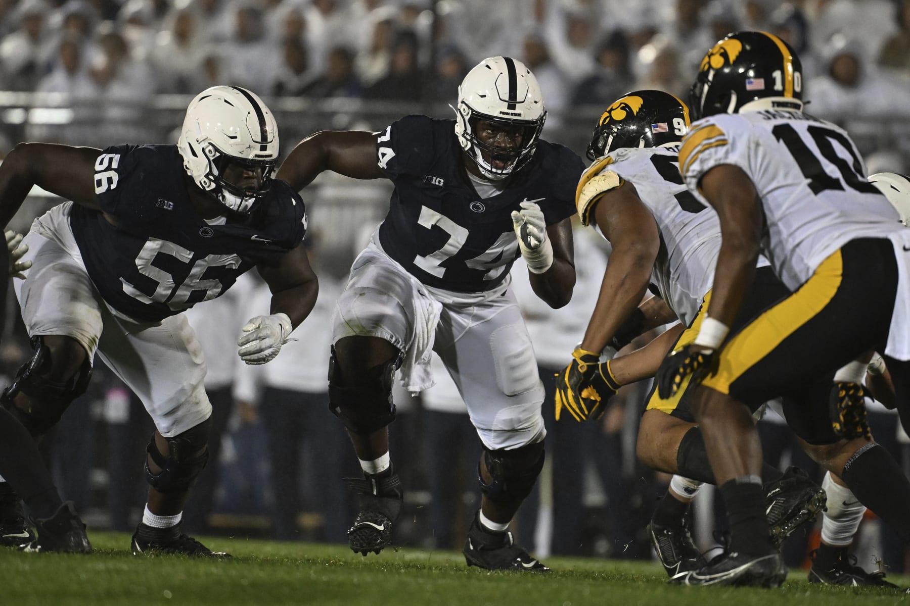Penn State offensive lineman Olumuyiwa Fashanu (74) and JB Nelson (56) look for someone to block during the second half of an NCAA college football game against Iowa, Saturday, Sept. 23, 2023, in State College, Pa. (AP Photo/Barry Reeger)