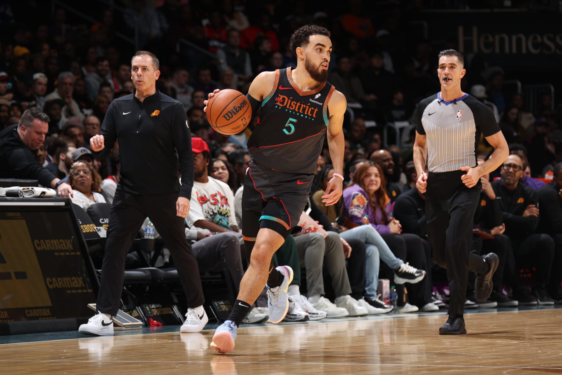 WASHINGTON, DC -  FEBRUARY 4: Tyus Jones #5 of the Washington Wizards dribbles the ball during the game against the Phoenix Suns on February 4, 2024 at Capital One Arena in Washington, DC. NOTE TO USER: User expressly acknowledges and agrees that, by downloading and or using this Photograph, user is consenting to the terms and conditions of the Getty Images License Agreement. Mandatory Copyright Notice: Copyright 2024 NBAE (Photo by Stephen Gosling/NBAE via Getty Images)