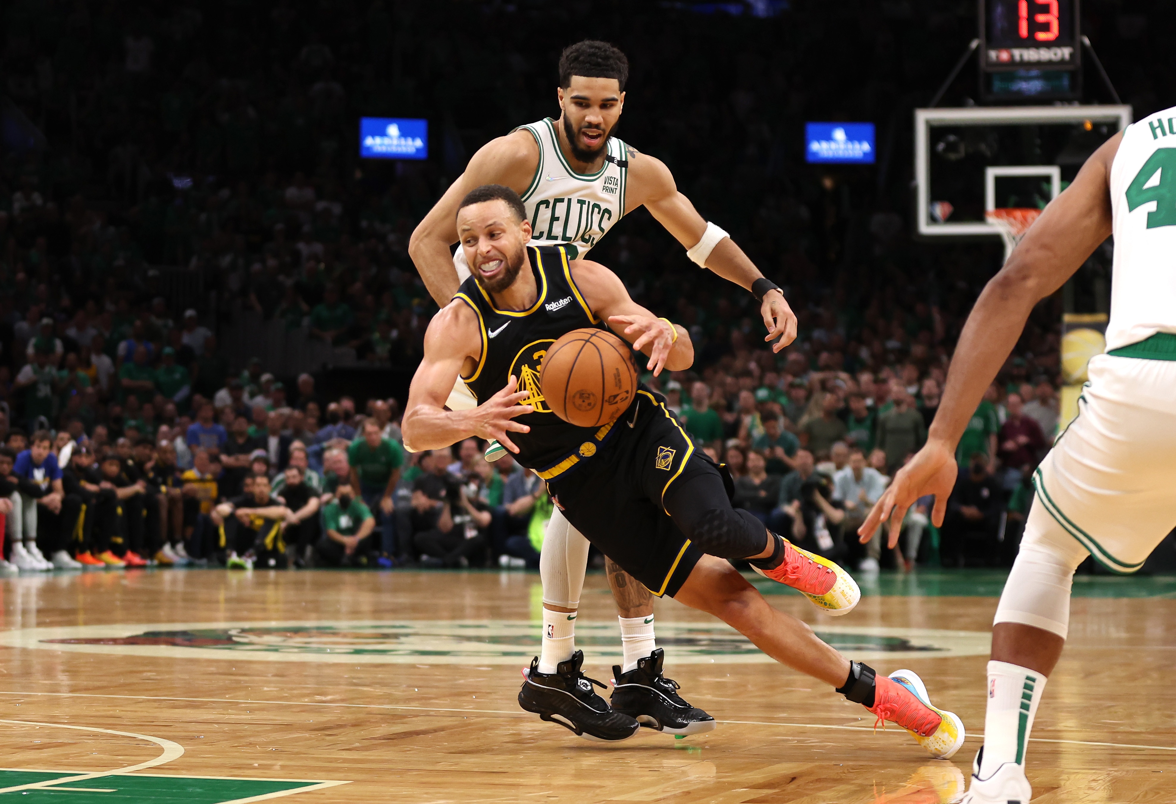BOSTON, MASSACHUSETTS - JUNE 08: Stephen Curry #30 of the Golden State Warriors loses control of the ball against Jayson Tatum #0 of the Boston Celtics in the fourth quarter during Game Three of the 2022 NBA Finals at TD Garden on June 08, 2022 in Boston, Massachusetts. The Boston Celtics won 116-100. NOTE TO USER: User expressly acknowledges and agrees that, by downloading and/or using this photograph, User is consenting to the terms and conditions of the Getty Images License Agreement. (Photo by Maddie Meyer/Getty Images)