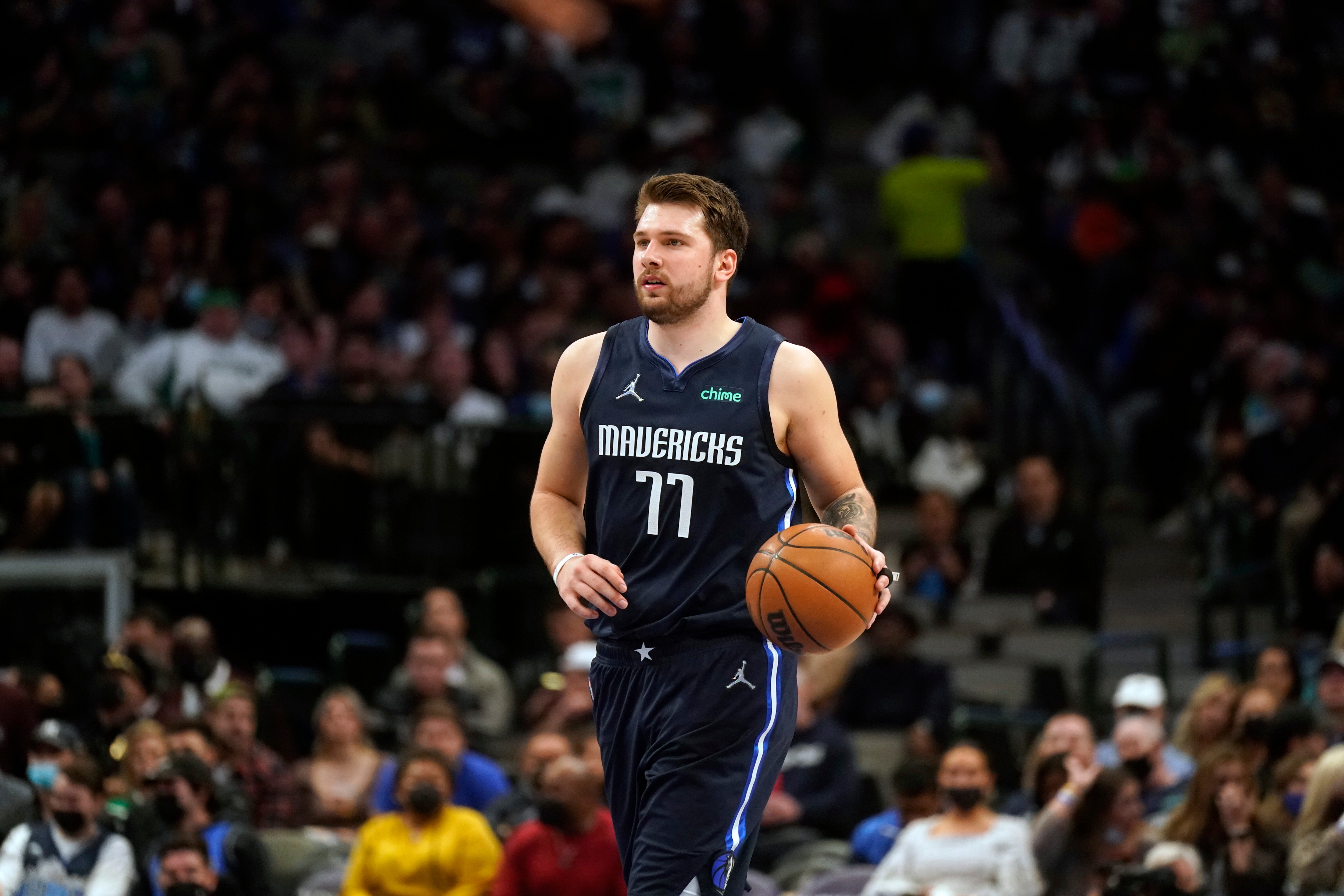 Dallas Mavericks guard Luka Doncic (77) dribbles during the fourth quarter of an NBA basketball game against the Los Angeles Clippers in Dallas, Thursday, Feb. 10, 2022. (AP Photo/LM Otero)