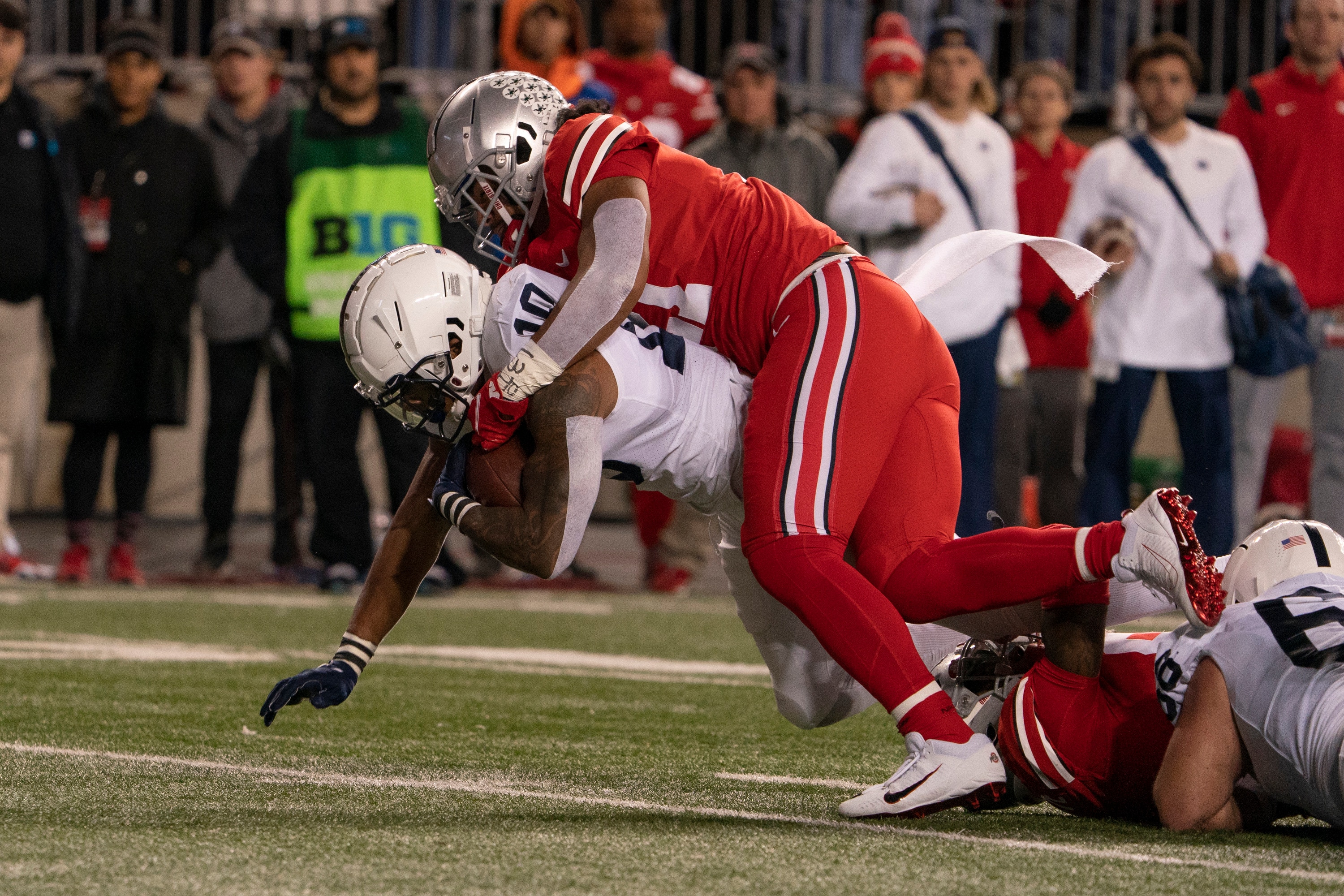 COLUMBUS, OH - OCTOBER 30: Running back John Lovett #10 of the Penn State Nittany Lions being tackled by defensive end Tyreke Smith #11 of the Ohio State Buckeyes during the game between the Ohio State Buckeyes and the Penn State Nittany Lions at Ohio Stadium in Columbus, Ohio on October 30, 2021.(Photo by Jason Mowry/Icon Sportswire via Getty Images)