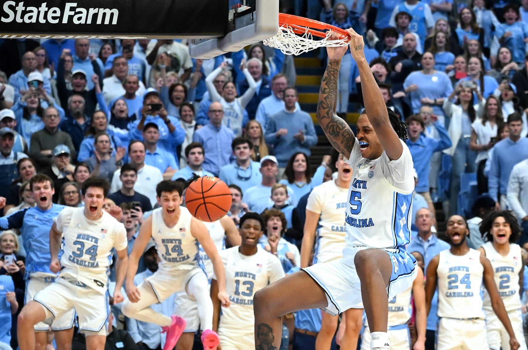 CHAPEL HILL, NORTH CAROLINA - FEBRUARY 03: Armando Bacot #5 of the North Carolina Tar Heels dunks during the closing seconds of a win against the Duke Blue Devils at the Dean E. Smith Center on February 03, 2024 in Chapel Hill, North Carolina. The Tar Heels won 93-84. (Photo by Grant Halverson/Getty Images)