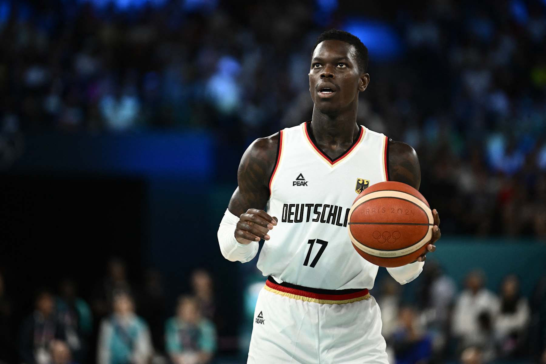 Germany's #17 Dennis Schroder handles the ball in the men's Bronze Medal basketball match between Germany and Serbia during the Paris 2024 Olympic Games at the Bercy  Arena in Paris on August 10, 2024. (Photo by Aris MESSINIS / AFP) (Photo by ARIS MESSINIS/AFP via Getty Images)