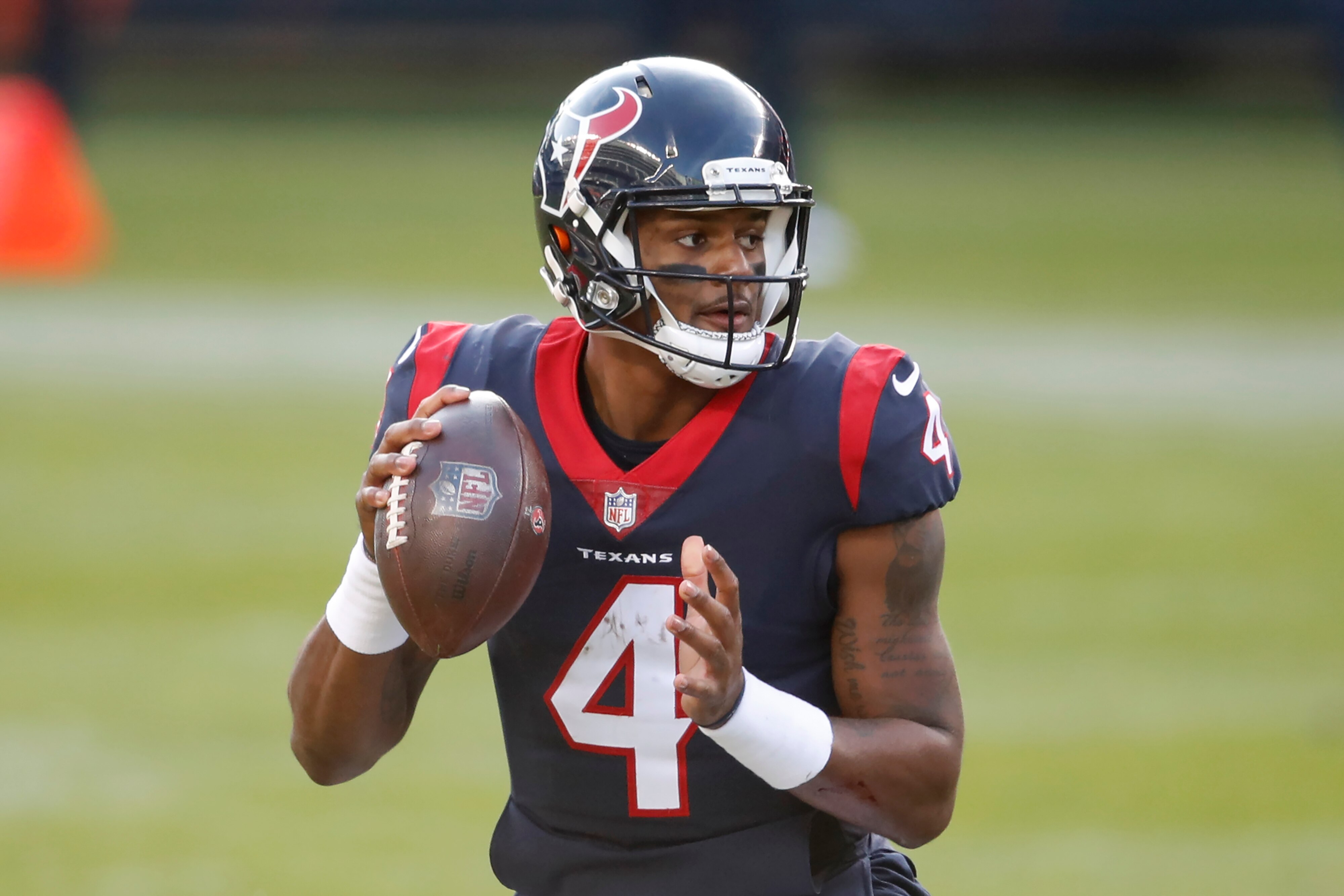 Houston Texans quarterback Deshaun Watson (4) looks to pass the ball during the second half of an NFL football game against the Chicago Bears, Sunday, Dec. 13, 2020, in Chicago. (AP Photo/Kamil Krzaczynski)