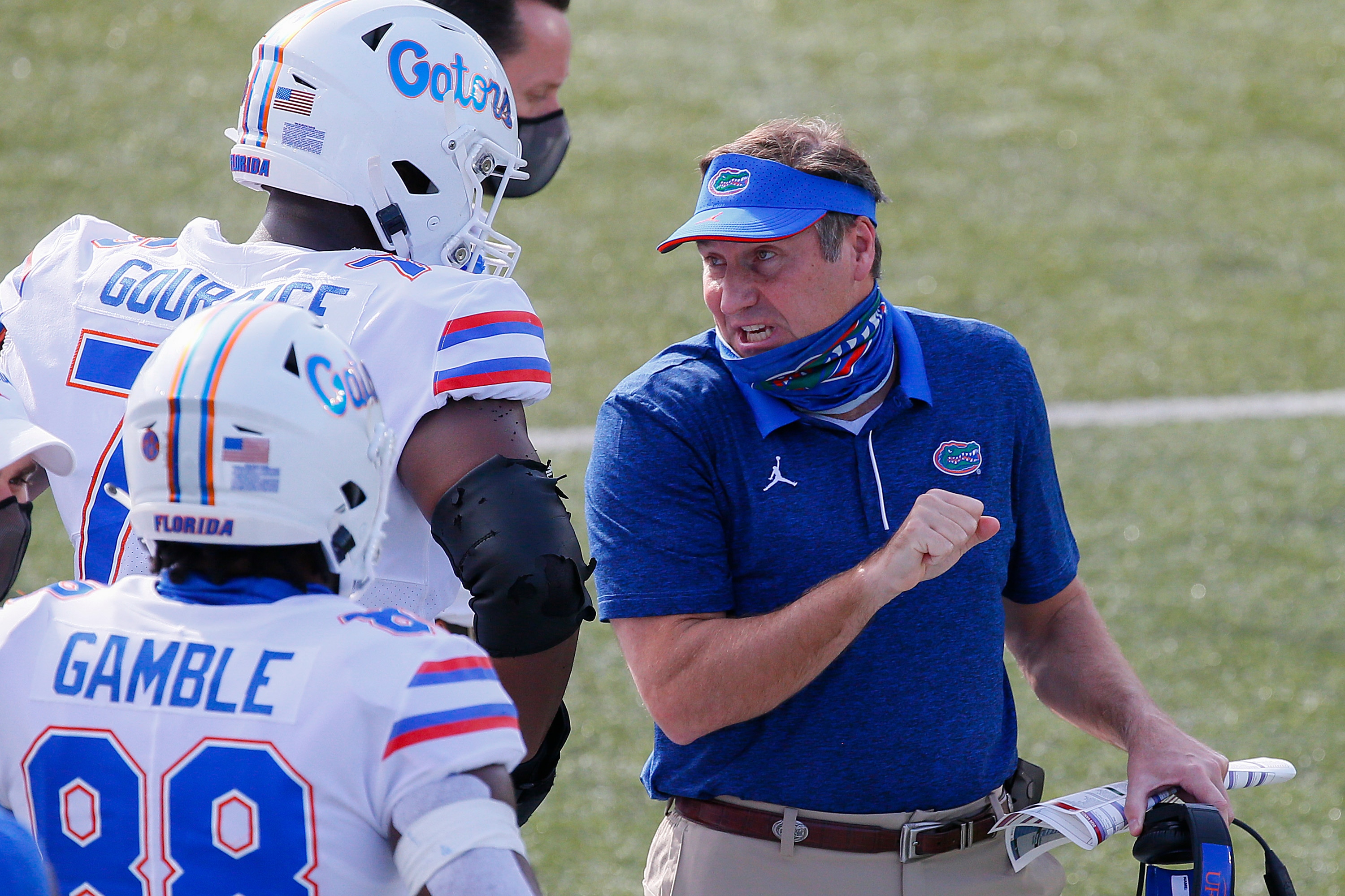 NASHVILLE, TENNESSEE - NOVEMBER 21: Head coach Dan Mullen of the Florida Gators speaks to Richard Gouraige #76 of the Florida Gators during the first half at of a game against the Vanderbilt Commodores Vanderbilt Stadium on November 21, 2020 in Nashville, Tennessee. (Photo by Frederick Breedon/Getty Images)