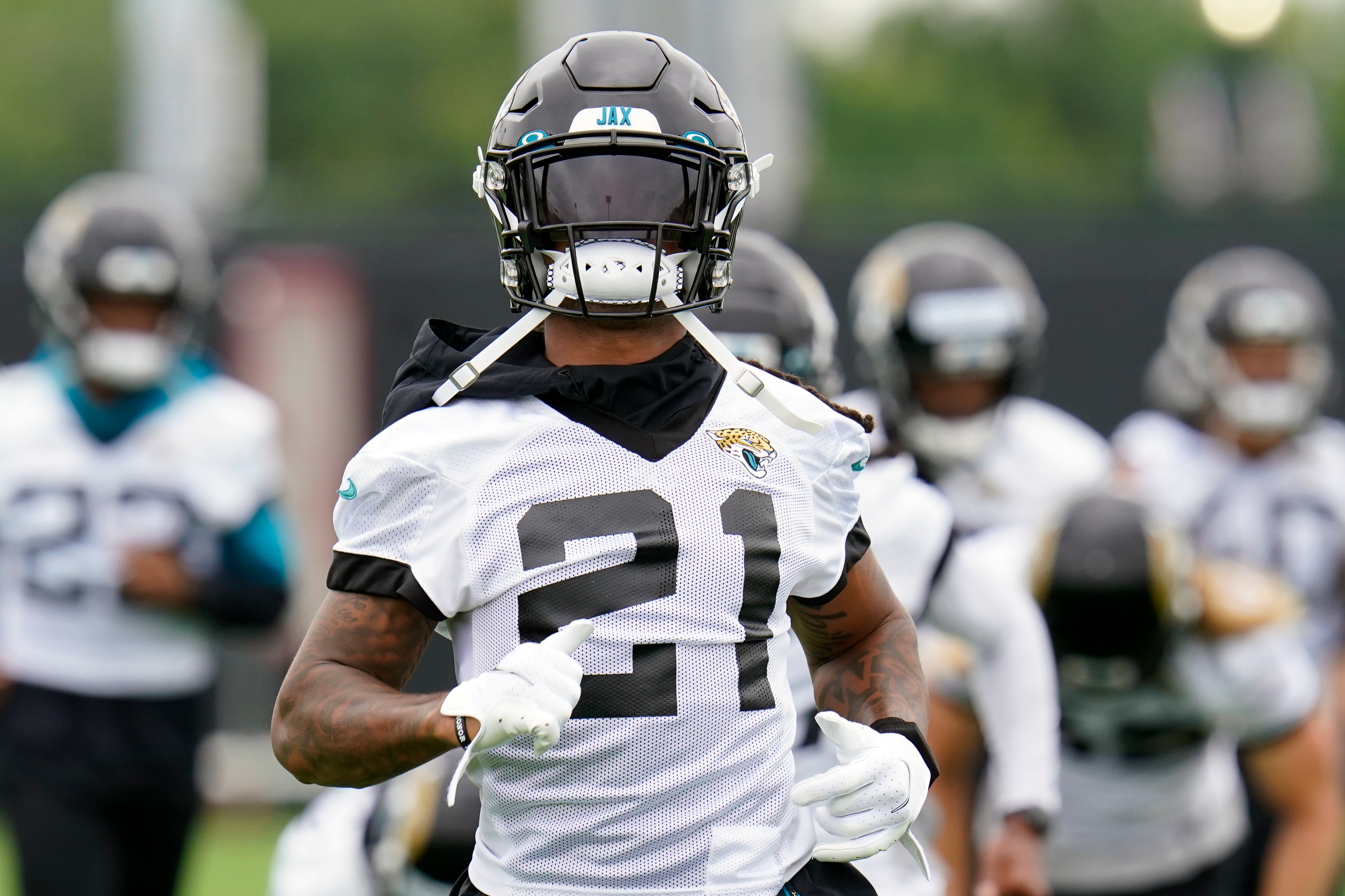 Jacksonville Jaguars cornerback Sidney Jones IV (21) runs sprints during an NFL football practice, Monday, June 14, 2021, in Jacksonville, Fla. (AP Photo/John Raoux)