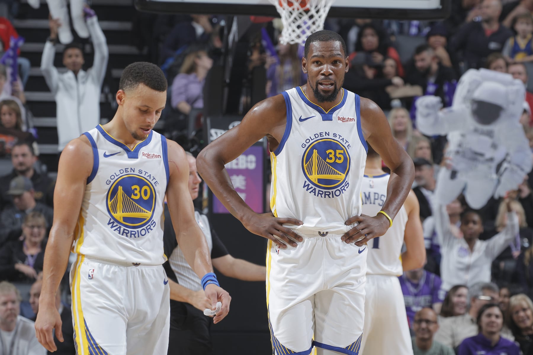 SACRAMENTO, CA - DECEMBER 14: Stephen Curry #30 and Kevin Durant #35 of the Golden State Warriors look on during the game against the Sacramento Kings on December 14, 2018 at Golden 1 Center in Sacramento, California. NOTE TO USER: User expressly acknowledges and agrees that, by downloading and or using this photograph, User is consenting to the terms and conditions of the Getty Images Agreement. Mandatory Copyright Notice: Copyright 2018 NBAE (Photo by Rocky Widner/NBAE via Getty Images)