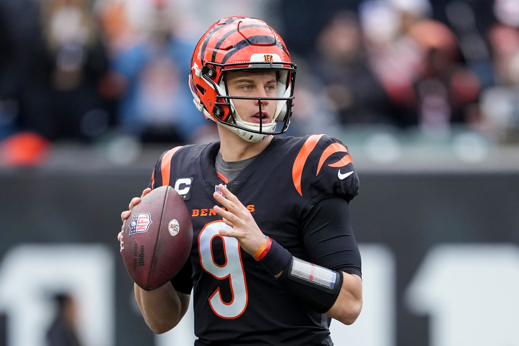CINCINNATI, OHIO - JANUARY 08: Joe Burrow #9 of the Cincinnati Bengals drops back to pass in the first quarter against the Baltimore Ravens at Paycor Stadium on January 08, 2023 in Cincinnati, Ohio. (Photo by Dylan Buell/Getty Images)