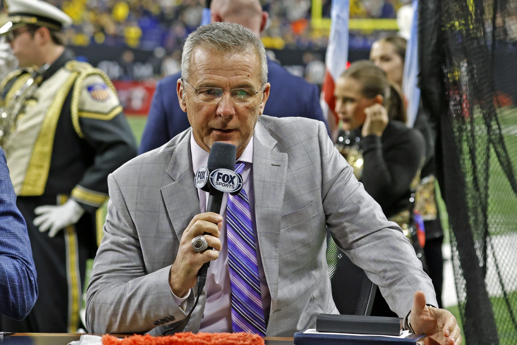 INDIANAPOLIS, IN - DECEMBER 03: Fox Sports announcer Urban Meyer talks on air during half time of the Purdue Boilermakers playing against the Michigan Wolverines on December 3, 2022, during the Big 10 Football Championship at Lucas Oil Stadium in Indianapolis, Indiana. (Photo by Brian Spurlock/Icon Sportswire via Getty Images)