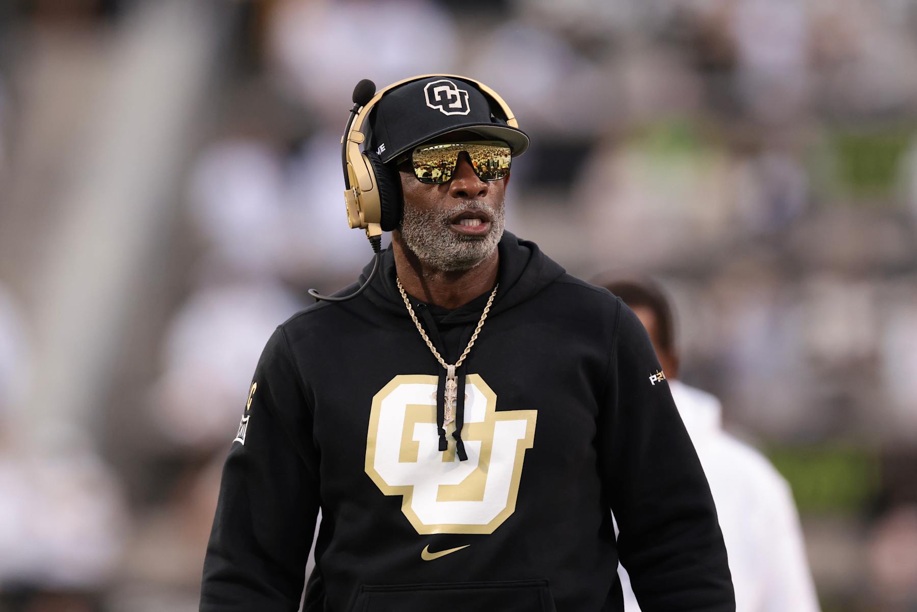 BOULDER, COLORADO - SEPTEMBER 21: Head coach Deion Sanders of the Colorado Buffaloes walks on the field during the first quarter  against the Baylor Bears at Folsom Field on September 21, 2024 in Boulder, Colorado. (Photo by Andrew Wevers/Getty Images)