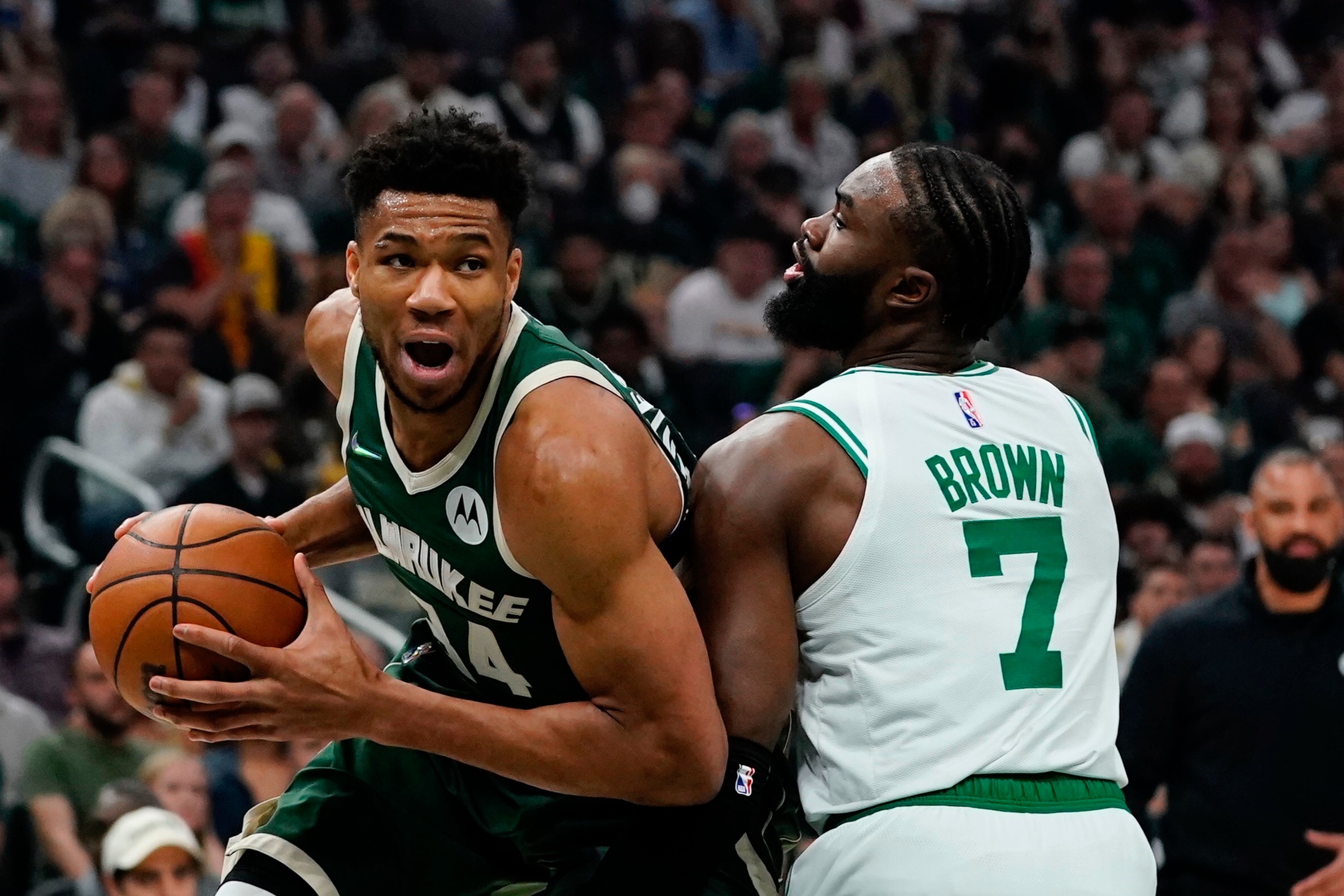 Milwaukee Bucks' Giannis Antetokounmpo is fouled by Boston Celtics' Jaylen Brown during the first half of Game 6 of an NBA basketball Eastern Conference semifinals playoff series Friday, May 13, 2022, in Milwaukee . (AP Photo/Morry Gash)