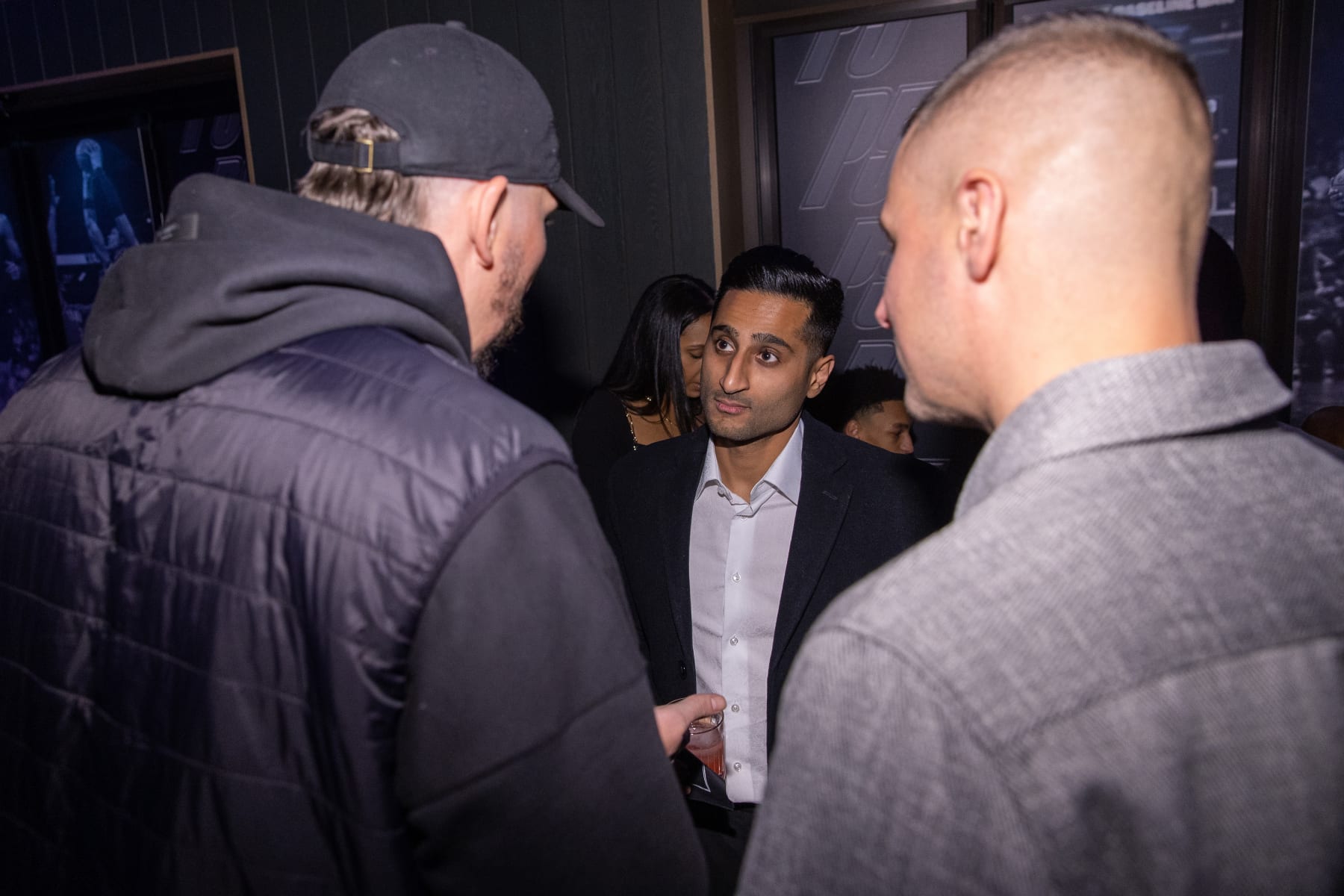 SALT LAKE CITY, UTAH - FEBRUARY 16: Shams Charania speaks with Mike Miller (L) and Donnie McGrath during the Paolo Banchero All Star Weekend kickoff party at Urban Hill on February 16, 2023 in Salt Lake City, Utah. (Photo by Mat Hayward/Getty Images for Paolo Banchero)