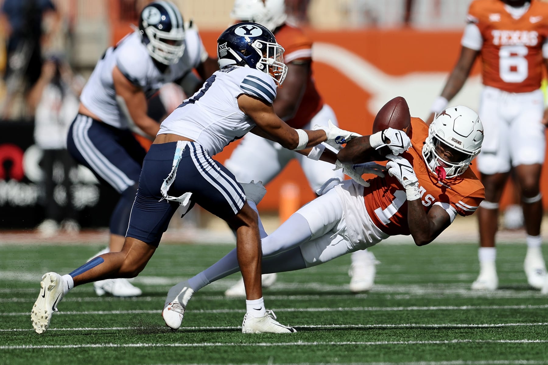 AUSTIN, TEXAS - OCTOBER 28: Jakob Robinson #0 of the Brigham Young Cougars breaks up a pass intended for Xavier Worthy #1 of the Texas Longhorns in the first quarter at Darrell K Royal-Texas Memorial Stadium on October 28, 2023 in Austin, Texas. (Photo by Tim Warner/Getty Images)