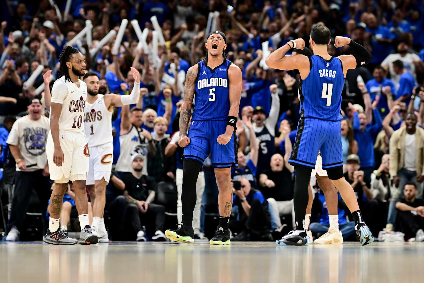 ORLANDO, FLORIDA - MAY 03: Paolo Banchero #5 of the Orlando Magic celebrates with Jalen Suggs #4 after a basket against the Cleveland Cavaliers during the fourth quarter in Game Six of the Eastern Conference First Round Playoffs at Kia Center on May 03, 2024 in Orlando, Florida. NOTE TO USER: User expressly acknowledges and agrees that, by downloading and/or using this Photograph, user is consenting to the terms and conditions of the Getty Images License Agreement.  (Photo by Julio Aguilar/Getty Images)