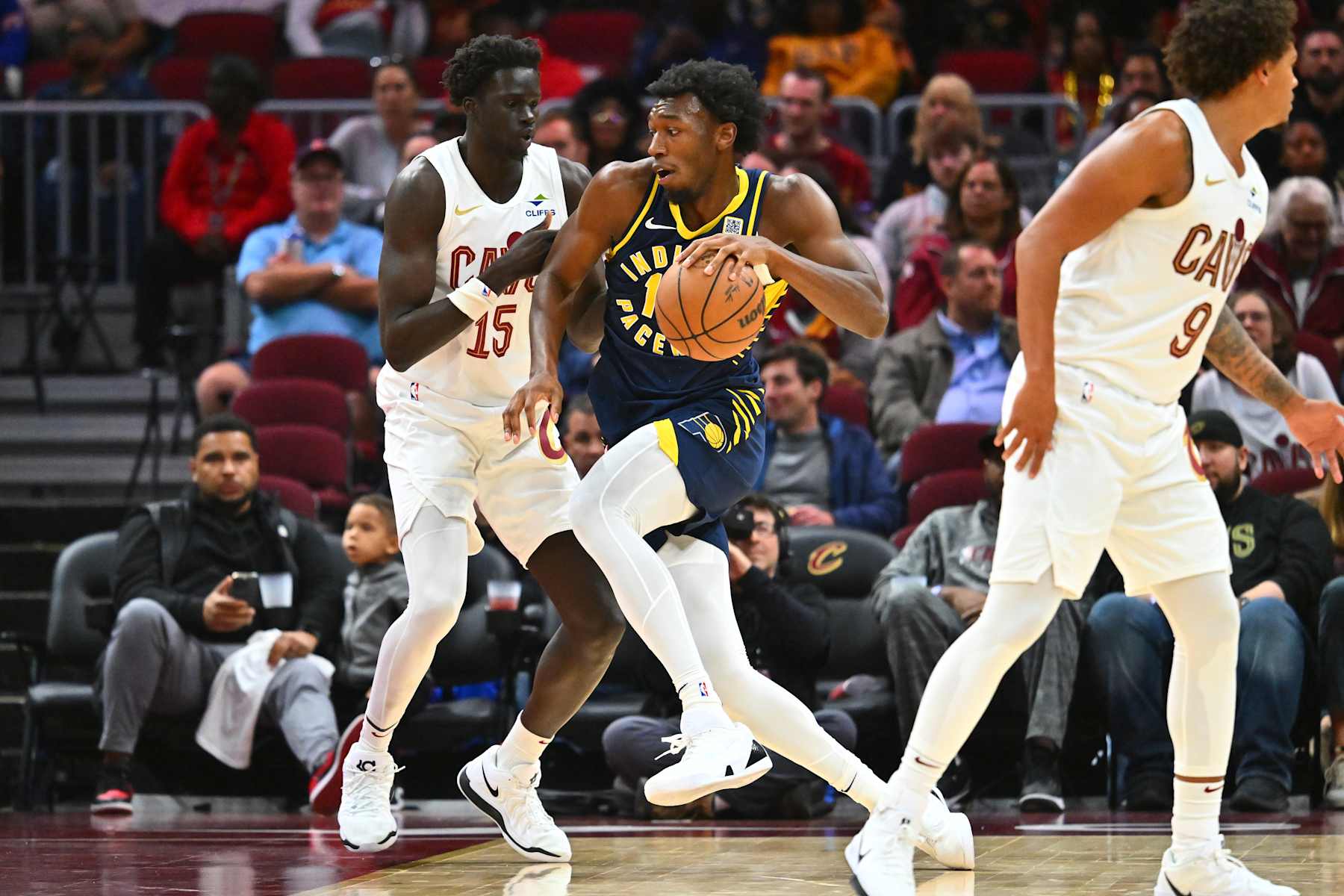 CLEVELAND, OHIO - OCTOBER 10: JT Thor #15 of the Cleveland Cavaliers guards James Wiseman #13 of the Indiana Pacers during the second half of a preseason game at Rocket Mortgage Fieldhouse on October 10, 2024 in Cleveland, Ohio. The Pacers defeated the Cavaliers 129-117. NOTE TO USER: User expressly acknowledges and agrees that, by downloading and or using this photograph, User is consenting to the terms and conditions of the Getty Images License Agreement. (Photo by Jason Miller/Getty Images)