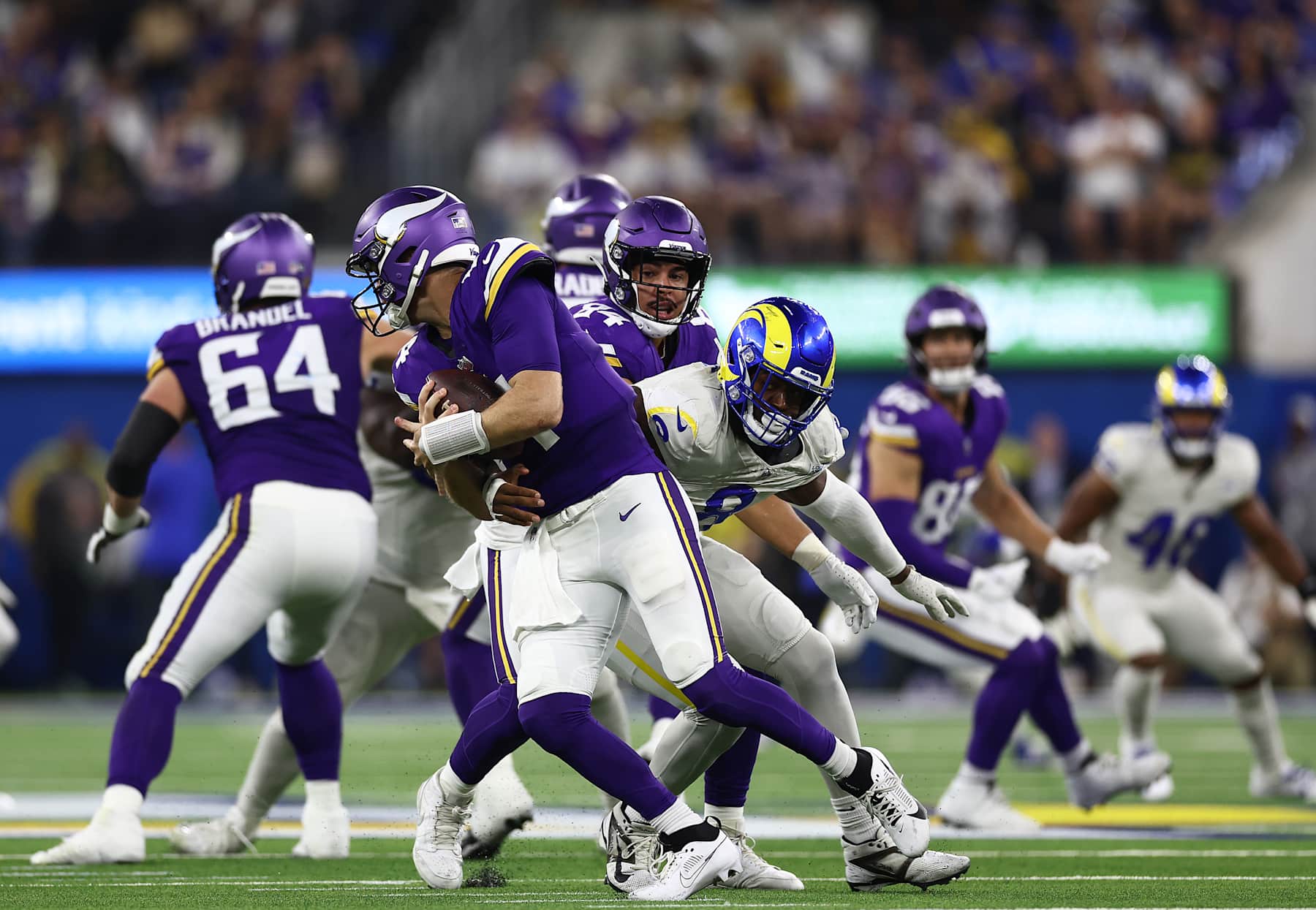 INGLEWOOD, CALIFORNIA - OCTOBER 24: Jared Verse #8 of the Los Angeles Rams makes the sack against Sam Darnold #14 of the Minnesota Vikings in the second quarter at SoFi Stadium on October 24, 2024 in Inglewood, California. (Photo by Katelyn Mulcahy/Getty Images)