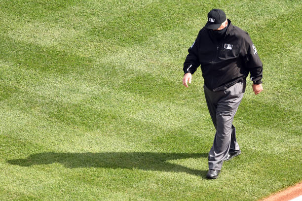 WASHINGTON, DC - SEPTEMBER 27:  Umpire Joe West walks to third base before a baseball game between the Washington Nationals and the New York Mets at Nationals Park on September 27, 2020 in Washington, DC.  (Photo by Mitchell Layton/Getty Images)
