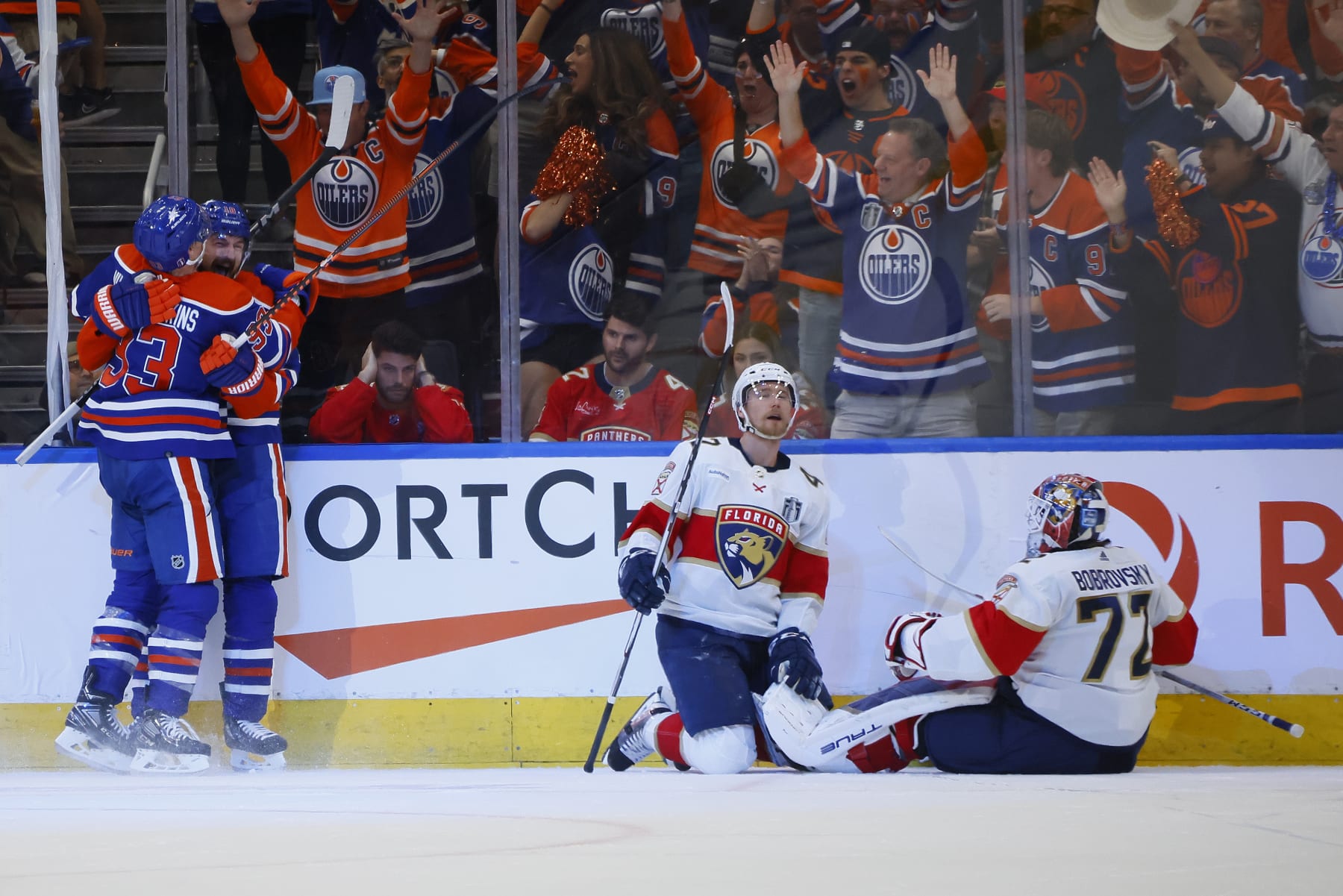 EDMONTON, ALBERTA - JUNE 21: Zach Hyman #18 and Ryan Nugent-Hopkins #93 of the Edmonton Oilers celebrate while Gustav Forsling #42 and Sergei Bobrovsky #72 of the Florida Panthers react after Hyman's goal during the second period of Game Six of the 2024 Stanley Cup Final at Rogers Place on June 21, 2024 in Edmonton, Alberta.  (Photo by Bruce Bennett/Getty Images)
