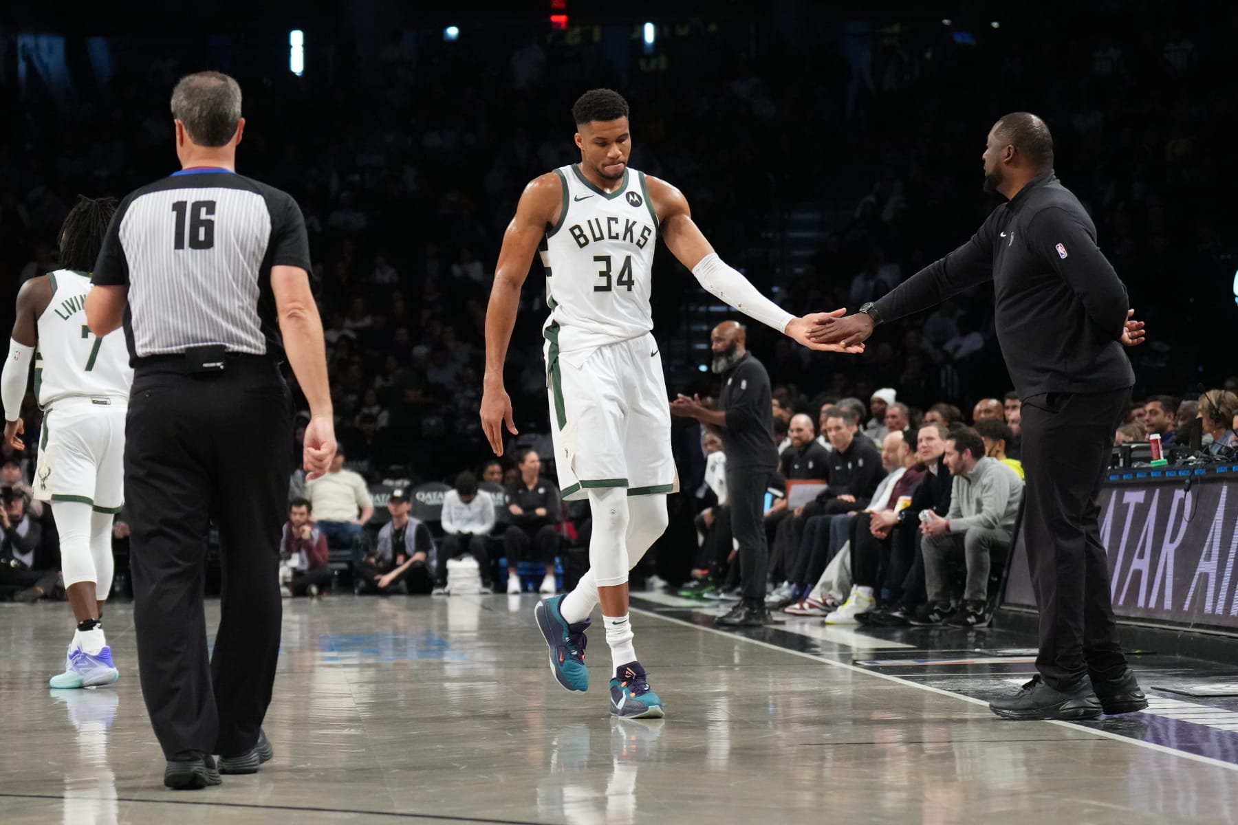 BROOKLYN, NY - DECEMBER 27: Giannis Antetokounmpo #34 high fives Head Coach Adrian Griffin of the Milwaukee Bucks during the game against the Brooklyn Nets on December 27, 2023 at Barclays Center in Brooklyn, New York. NOTE TO USER: User expressly acknowledges and agrees that, by downloading and or using this Photograph, user is consenting to the terms and conditions of the Getty Images License Agreement. Mandatory Copyright Notice: Copyright 2023 NBAE (Photo by Jesse D. Garrabrant/NBAE via Getty Images)