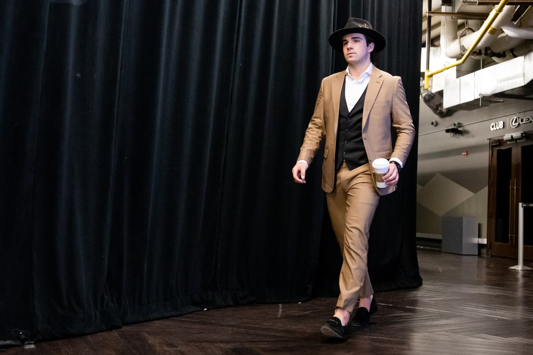 DENVER, COLORADO - MARCH 20: Alex Newhook #18 of the Colorado Avalanche arrives at Ball Arena ahead of the game against the Chicago Blackhawks on March 20, 2023 in Denver, Colorado. (Photo by Ashley Potts/NHLI via Getty Images)